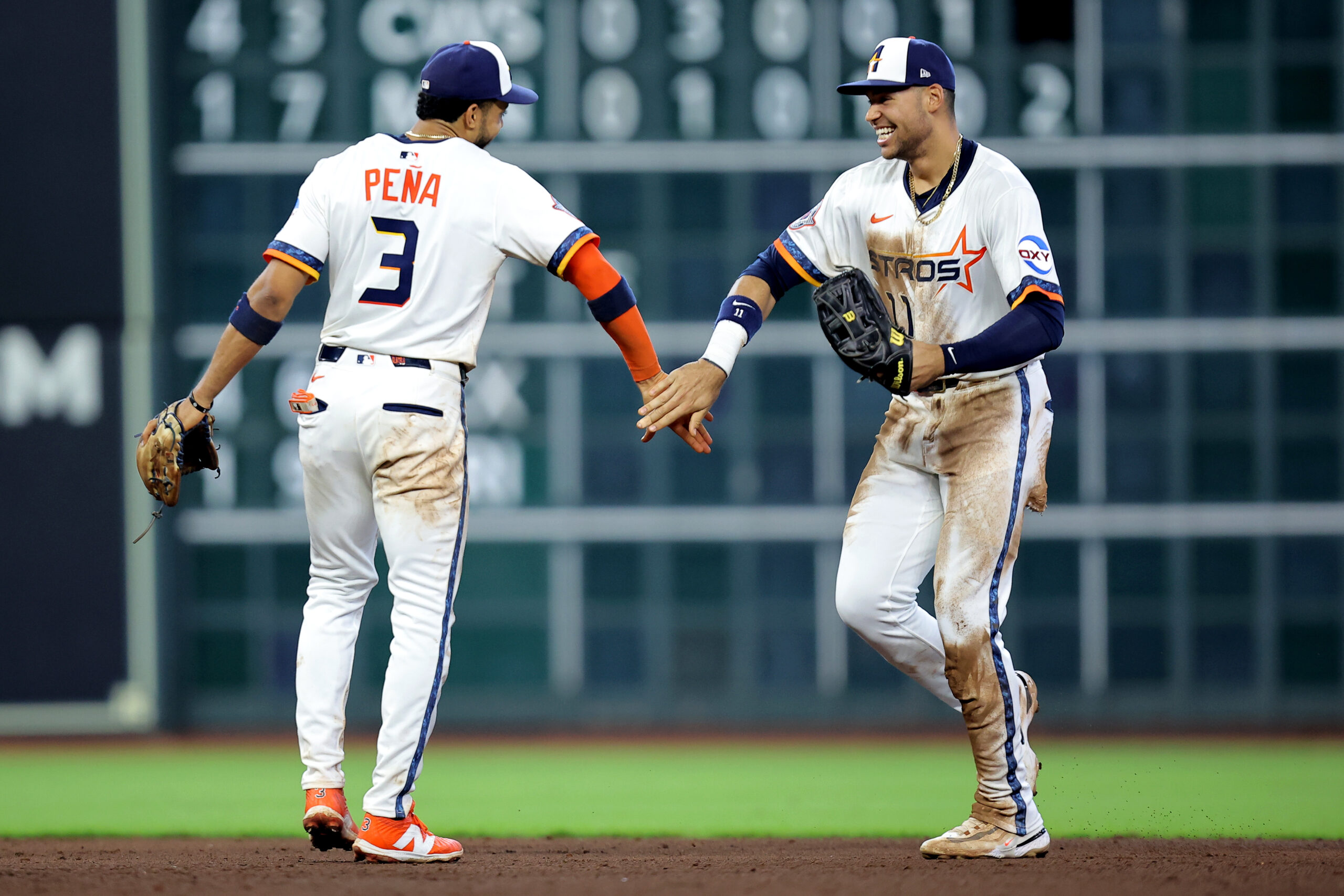 Sep 1, 2025; Houston, Texas, USA; Houston Astros right fielder Cam Smith (11) is congratulated by Houston Astros shortstop Jeremy Pena (3) after the final out against the Los Angeles Angels during the ninth inning at Daikin Park. Mandatory Credit: Erik Williams-Imagn Images