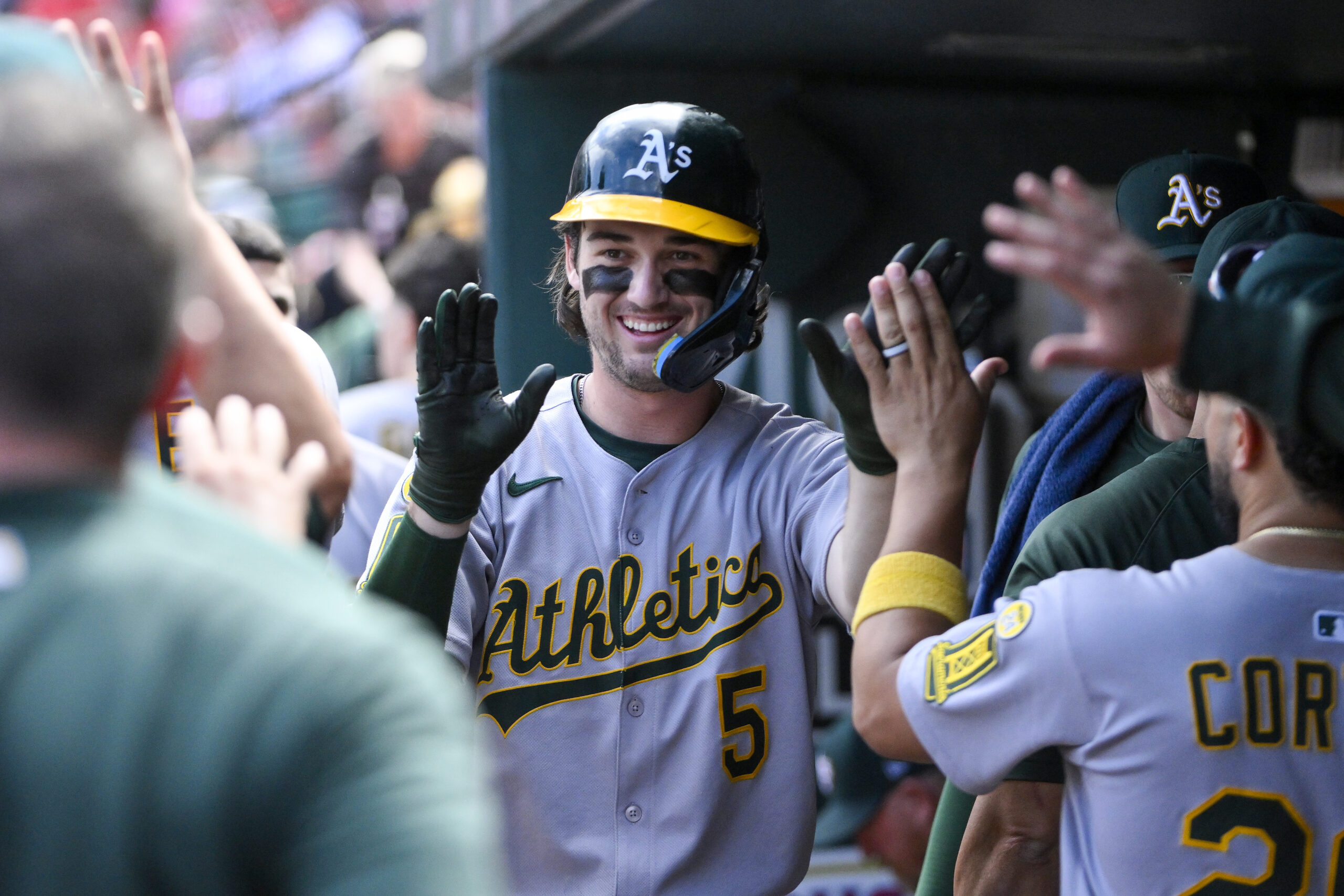 Sep 1, 2025; St. Louis, Missouri, USA;  Athletics shortstop Jacob Wilson (5) is congratulated by teammates after scoring against the St. Louis Cardinals during the seventh inning at Busch Stadium. Mandatory Credit: Jeff Curry-Imagn Images