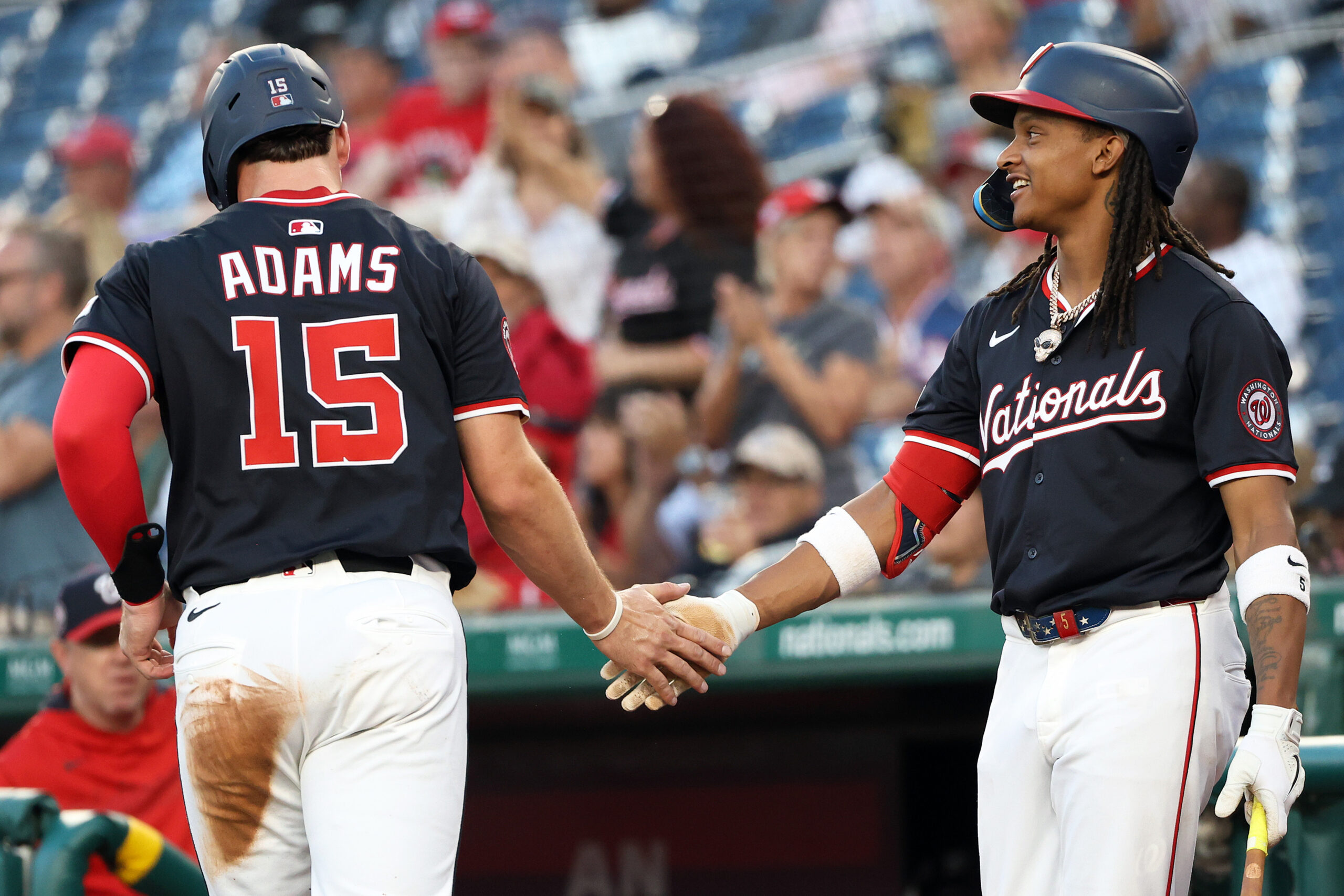 Sep 2, 2025; Washington, District of Columbia, USA; Washington Nationals catcher Riley Adams (15) celebrates with Washington Nationals shortstop CJ Abrams (5) after scoring a run during the second inning against the Miami Marlins at Nationals Park. Mandatory Credit: Daniel Kucin Jr.-Imagn Images