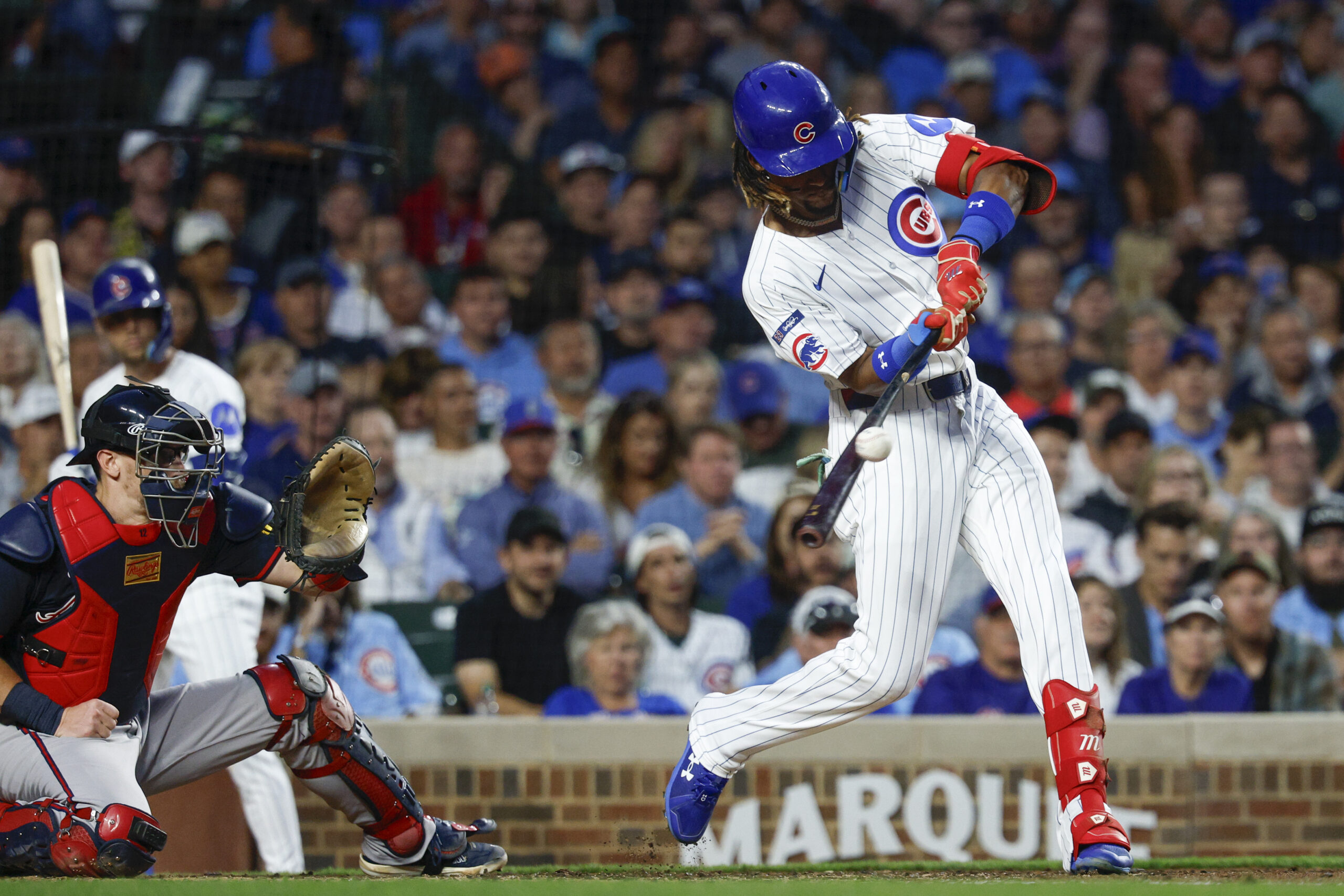 Sep 5, 2025; Chicago, Illinois, USA; Chicago Cubs center fielder Kevin Alcantara (13) singles against the Atlanta Braves during the third inning at Wrigley Field. Mandatory Credit: Kamil Krzaczynski-Imagn Images
