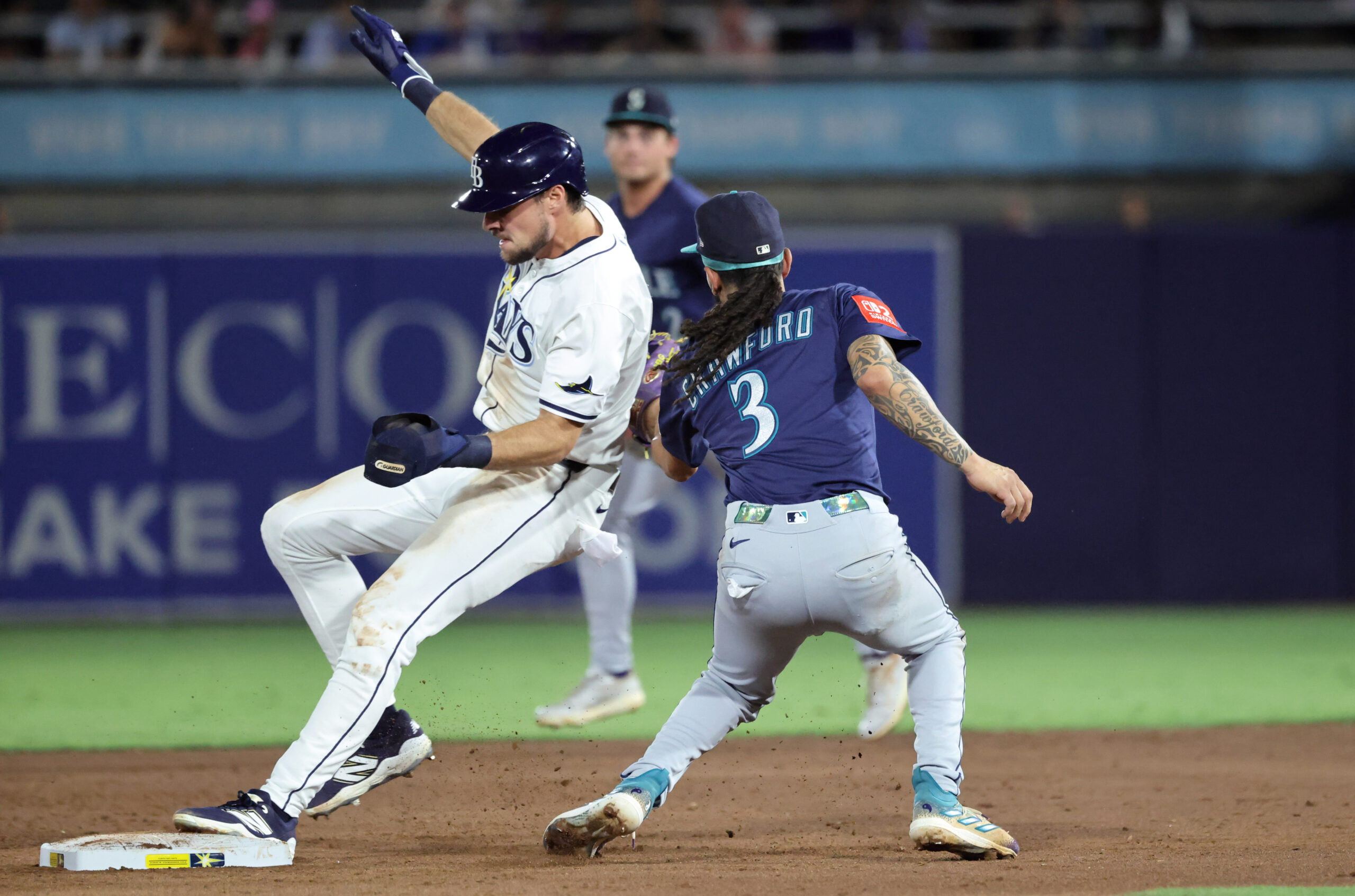 Sep 2, 2025; St. Petersburg, Florida, USA; Tampa Bay Rays outfielder Josh Lowe (15) steals second base as Seattle Mariners shortstop J.P. Crawford (3) attempted to tag him out during the third inning at George M. Steinbrenner Field. Mandatory Credit: Kim Klement Neitzel-Imagn Images