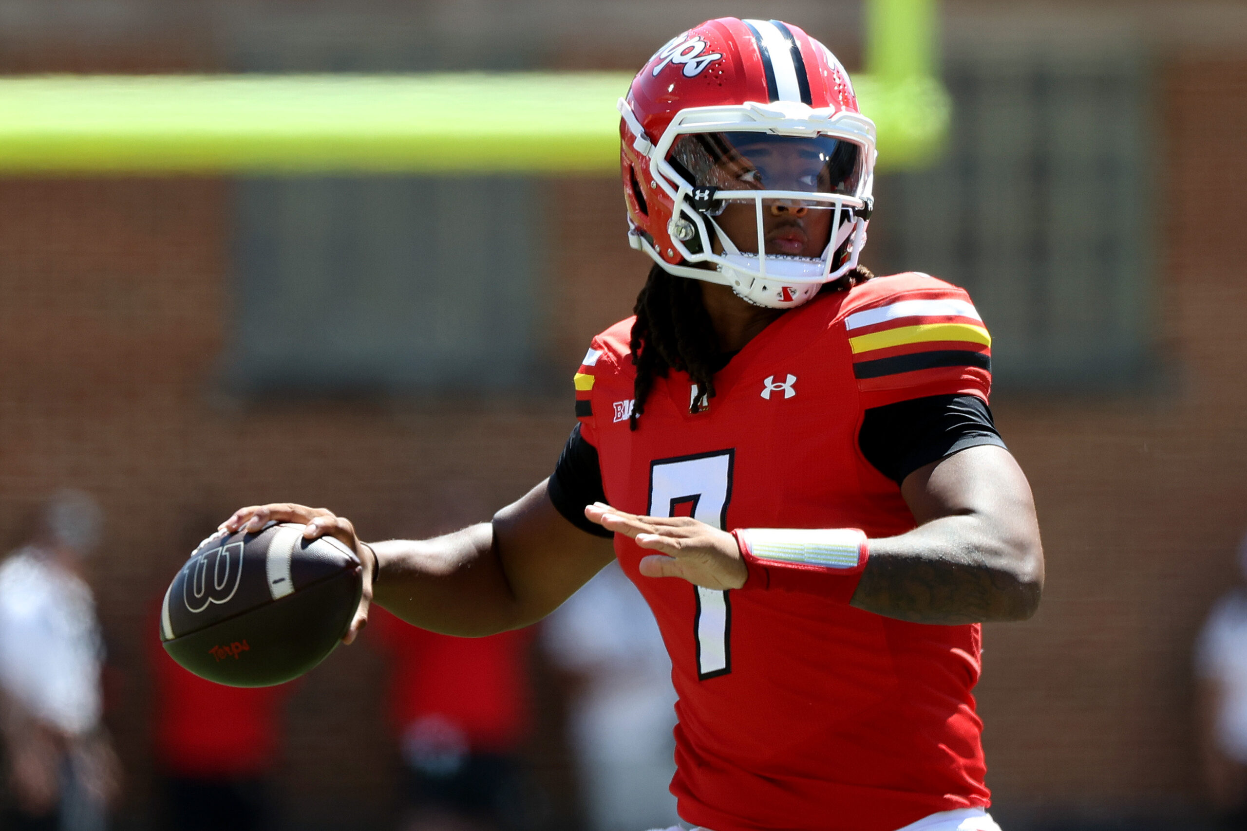 Aug 30, 2025; College Park, Maryland, USA; Maryland Terrapins quarterback Malik Washington (7) looks to throw the ball during the first half against the Florida Atlantic Owls at SECU Stadium. Mandatory Credit: Daniel Kucin Jr.-Imagn Images