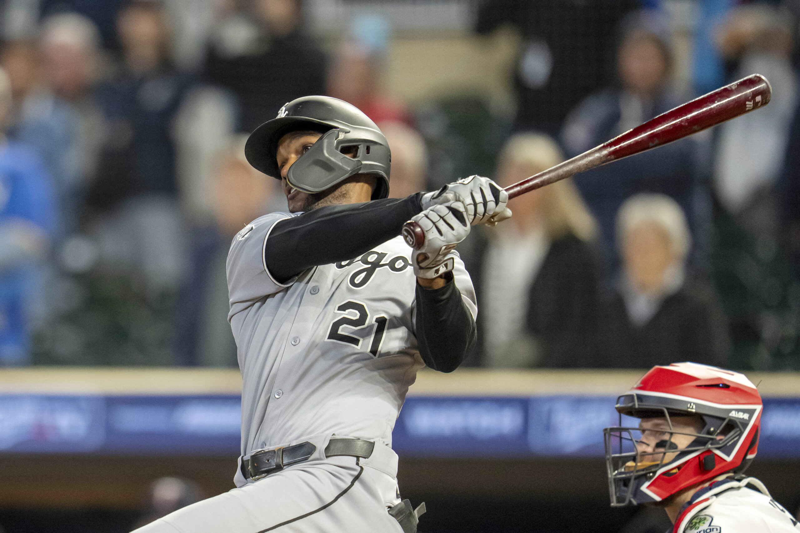Sep 3, 2025; Minneapolis, Minnesota, USA; Chicago White Sox center fielder Michael A. Taylor (21) hits a two run double against the Minnesota Twins in the ninth inning at Target Field. Mandatory Credit: Jesse Johnson-Imagn Images