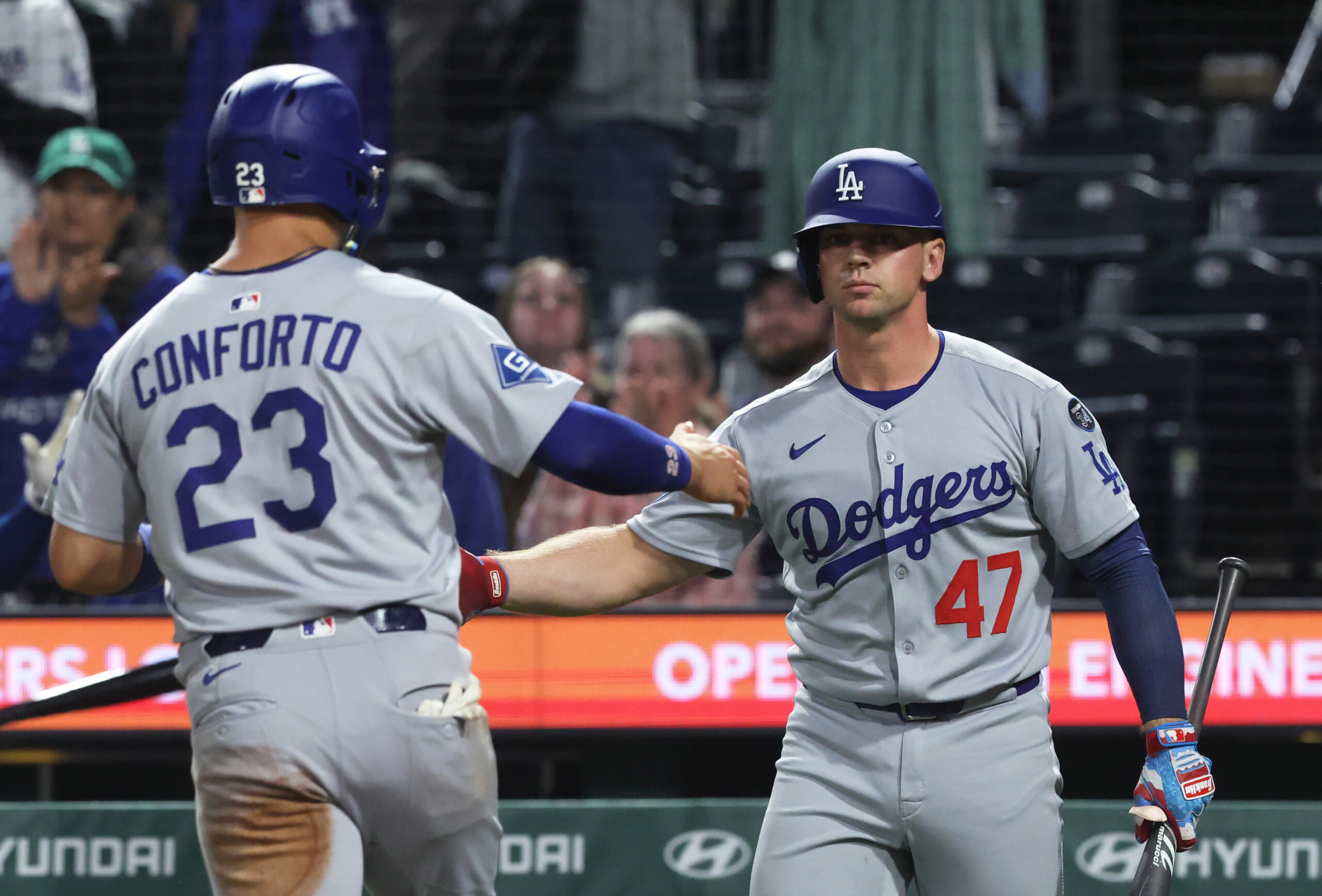 Sep 4, 2025; Pittsburgh, Pennsylvania, USA;  Los Angeles Dodgers catcher Ben Rortvedt (47) congratulates left fielder Michael Conforto (23) crossing home plate to score a run against the Pittsburgh Pirates at PNC Park. Mandatory Credit: Charles LeClaire-Imagn Images