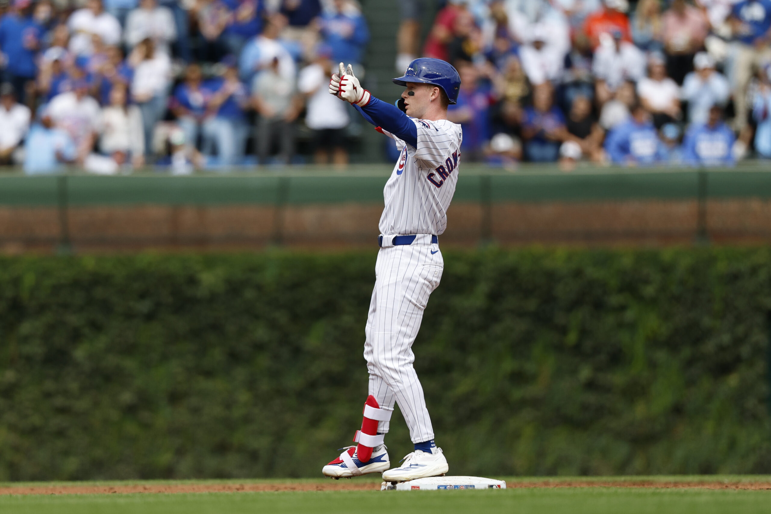 Sep 6, 2025; Chicago, Illinois, USA; Chicago Cubs left fielder Pete Crow-Armstrong (4) celebrates after hitting a double against the Washington Nationals during the second inning at Wrigley Field. Mandatory Credit: Kamil Krzaczynski-Imagn Images