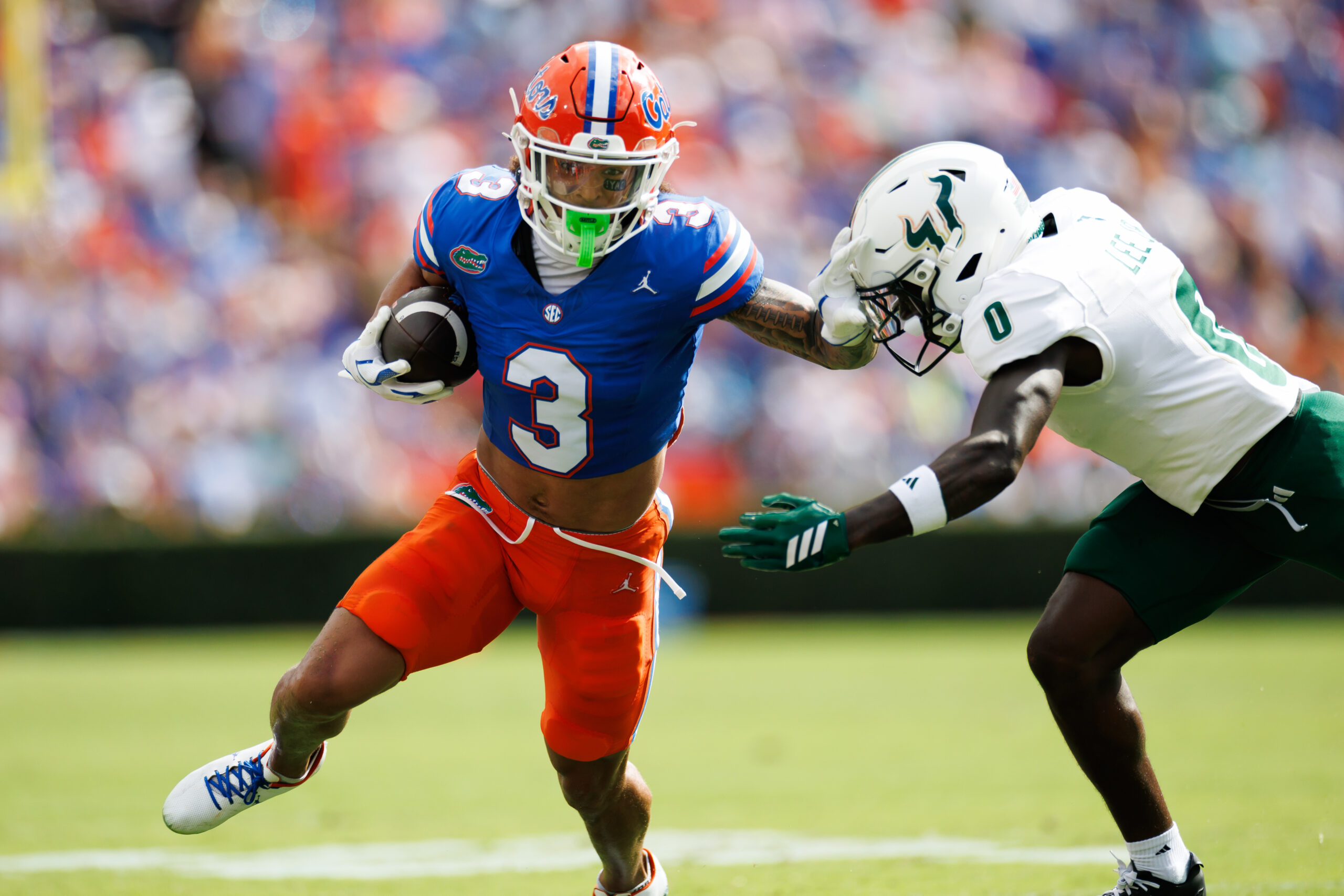 Sep 6, 2025; Gainesville, Florida, USA; Florida Gators wide receiver Eugene Wilson III (3) runs against South Florida Bulls cornerback Jarvis Lee (0) during the first half at Ben Hill Griffin Stadium. Mandatory Credit: Matt Pendleton-Imagn Images