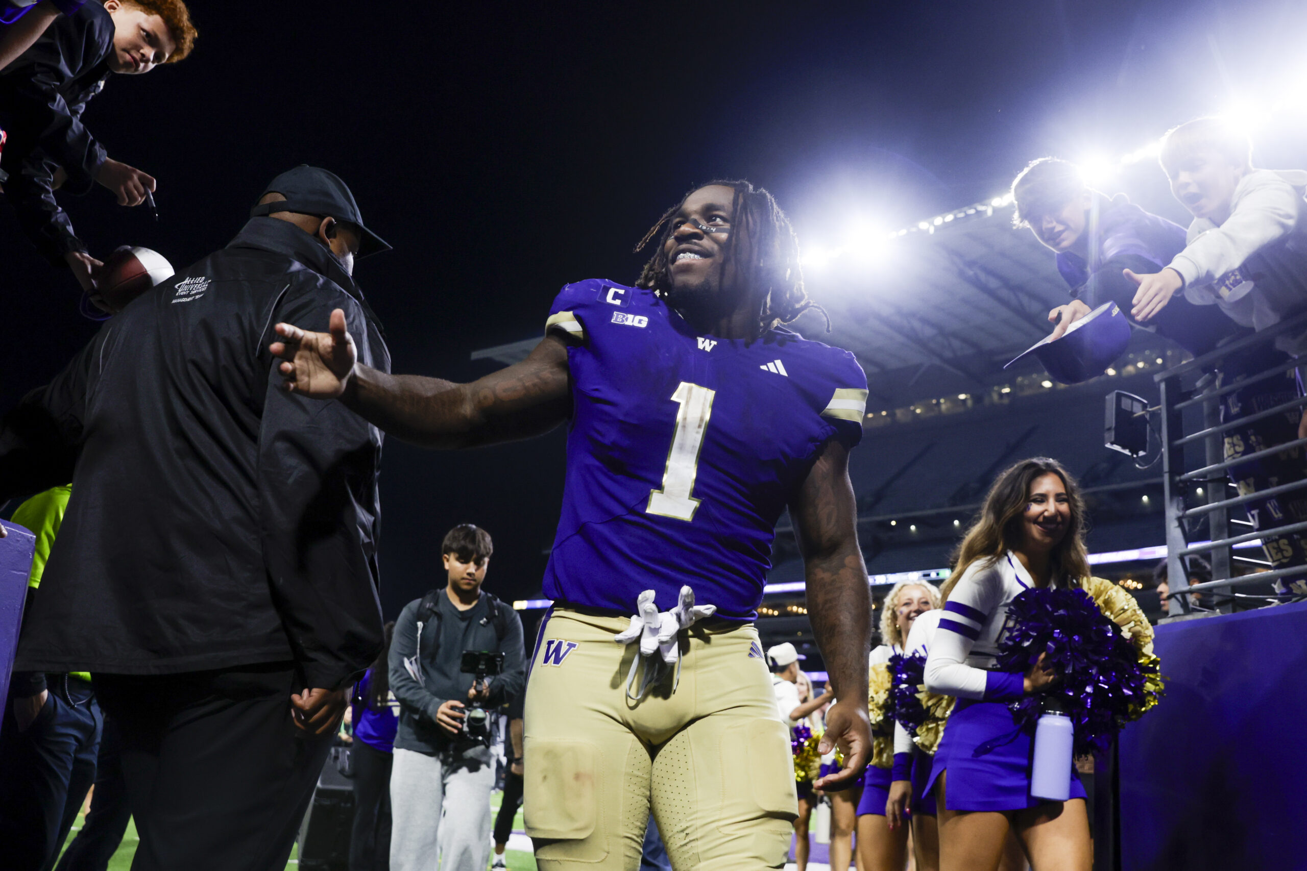 Sep 6, 2025; Seattle, Washington, USA; Washington Huskies running back Jonah Coleman (1) returns to the locker room following a victory against the UC Davis Aggies at Husky Stadium. Mandatory Credit: Joe Nicholson-Imagn Images