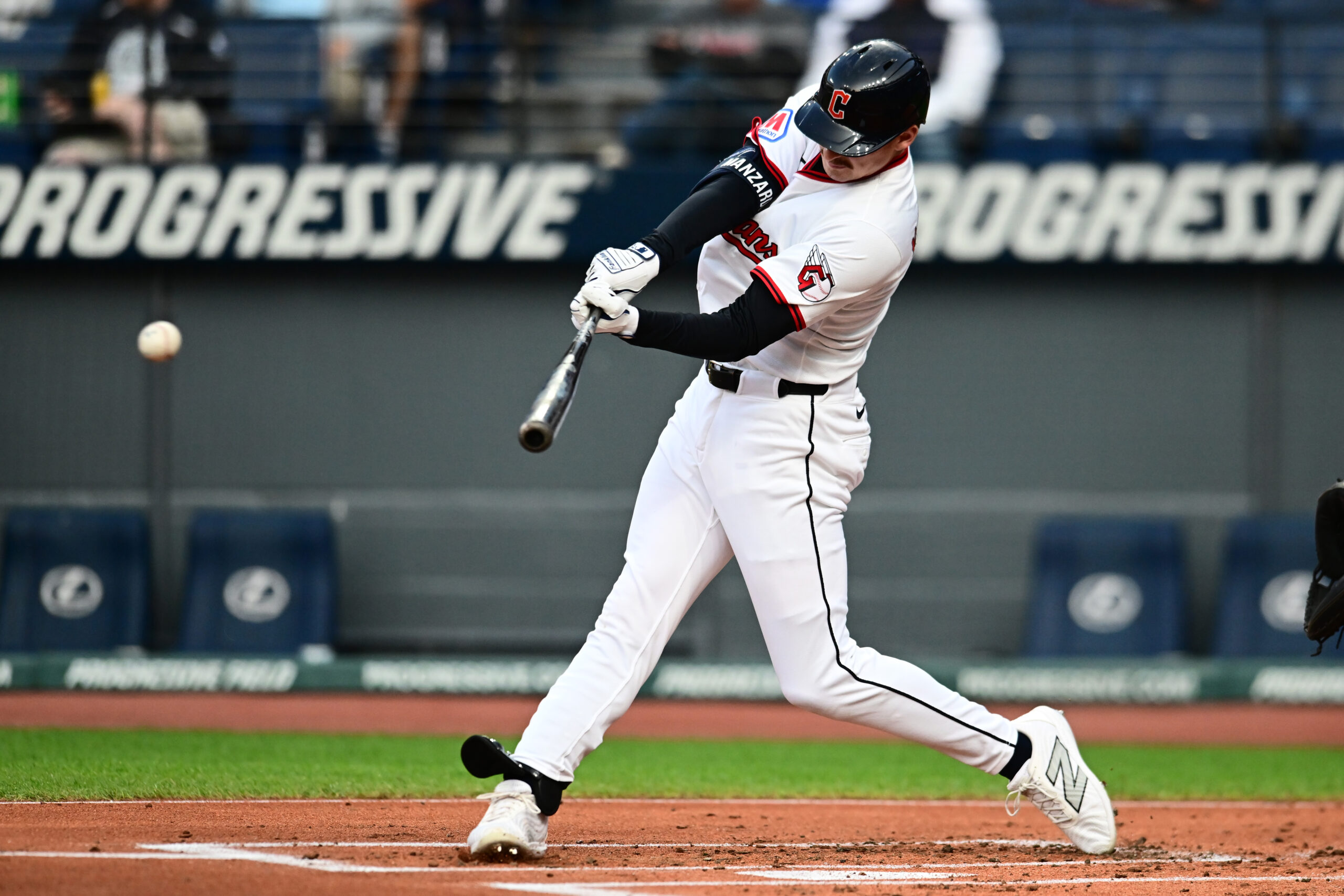 Sep 8, 2025; Cleveland, Ohio, USA; Cleveland Guardians designated hitter Kyle Manzardo (9) hits an RBI double against the Kansas City Royals during the first inning at Progressive Field. Mandatory Credit: Ken Blaze-Imagn Images