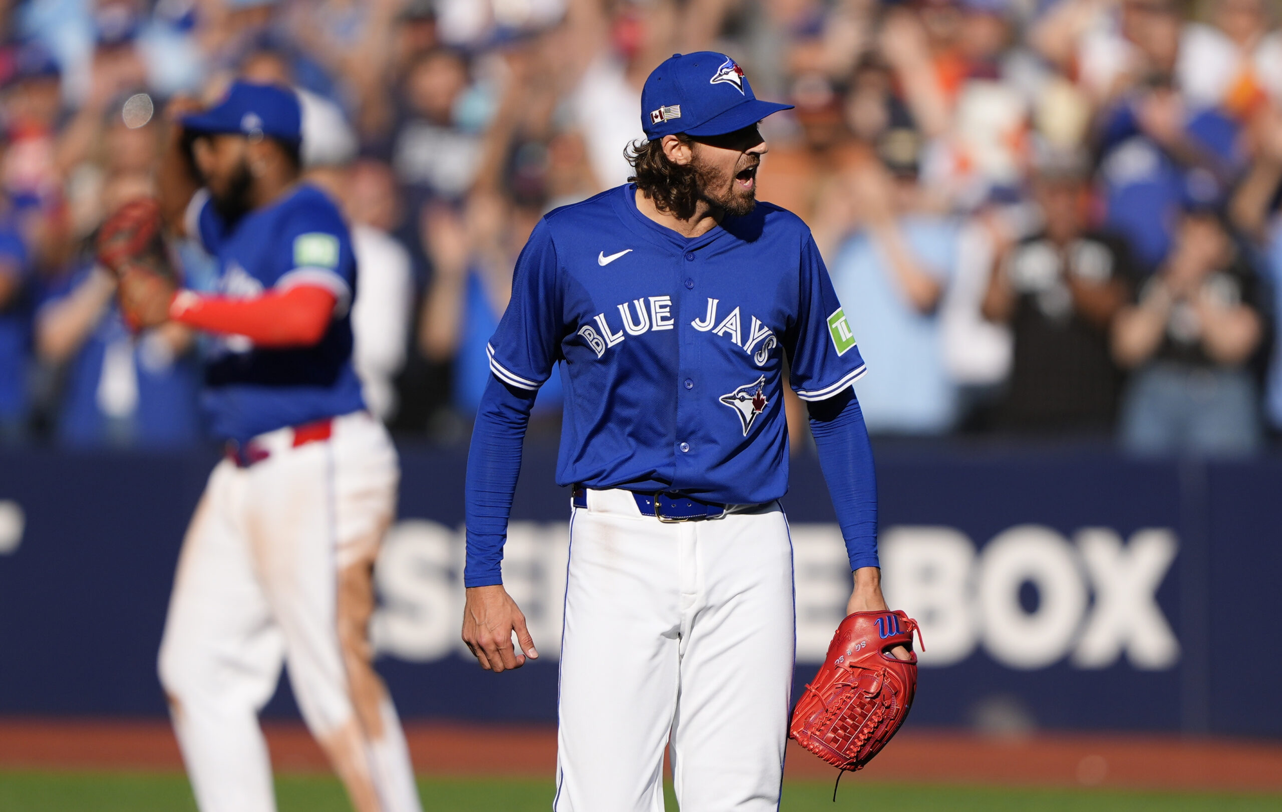 Sep 11, 2025; Toronto, Ontario, CAN; Toronto Blue Jays starting pitcher Kevin Gausman (34) reacts after a complete game win over the Houston Astros at Rogers Centre. Mandatory Credit: John E. Sokolowski-Imagn Images