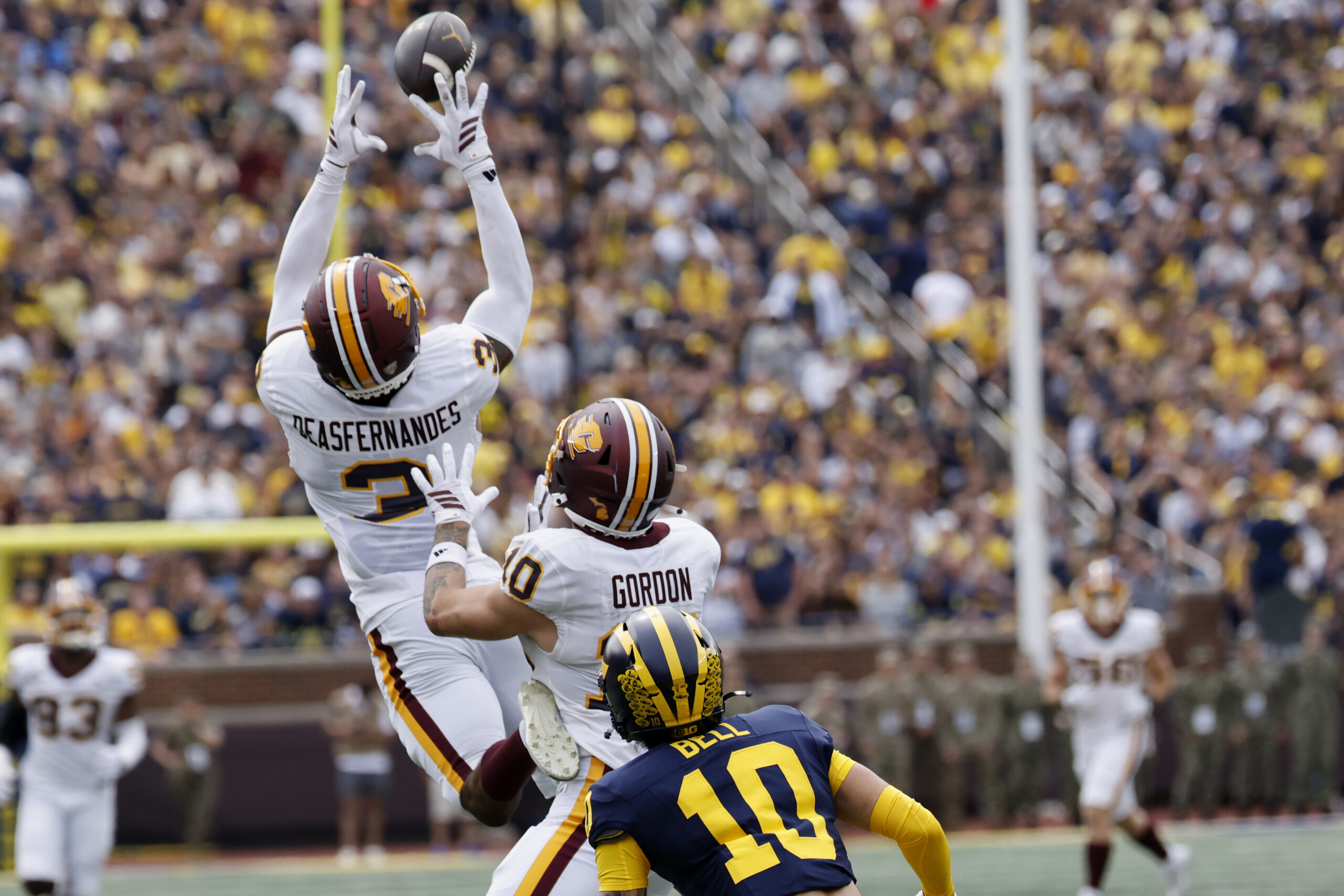 Sep 13, 2025; Ann Arbor, Michigan, USA; Central Michigan Chippewas defensive back Brenden Deasfernandes (3) makes an interception in the first half against the Michigan Wolverines at Michigan Stadium. Mandatory Credit: Rick Osentoski-Imagn Images