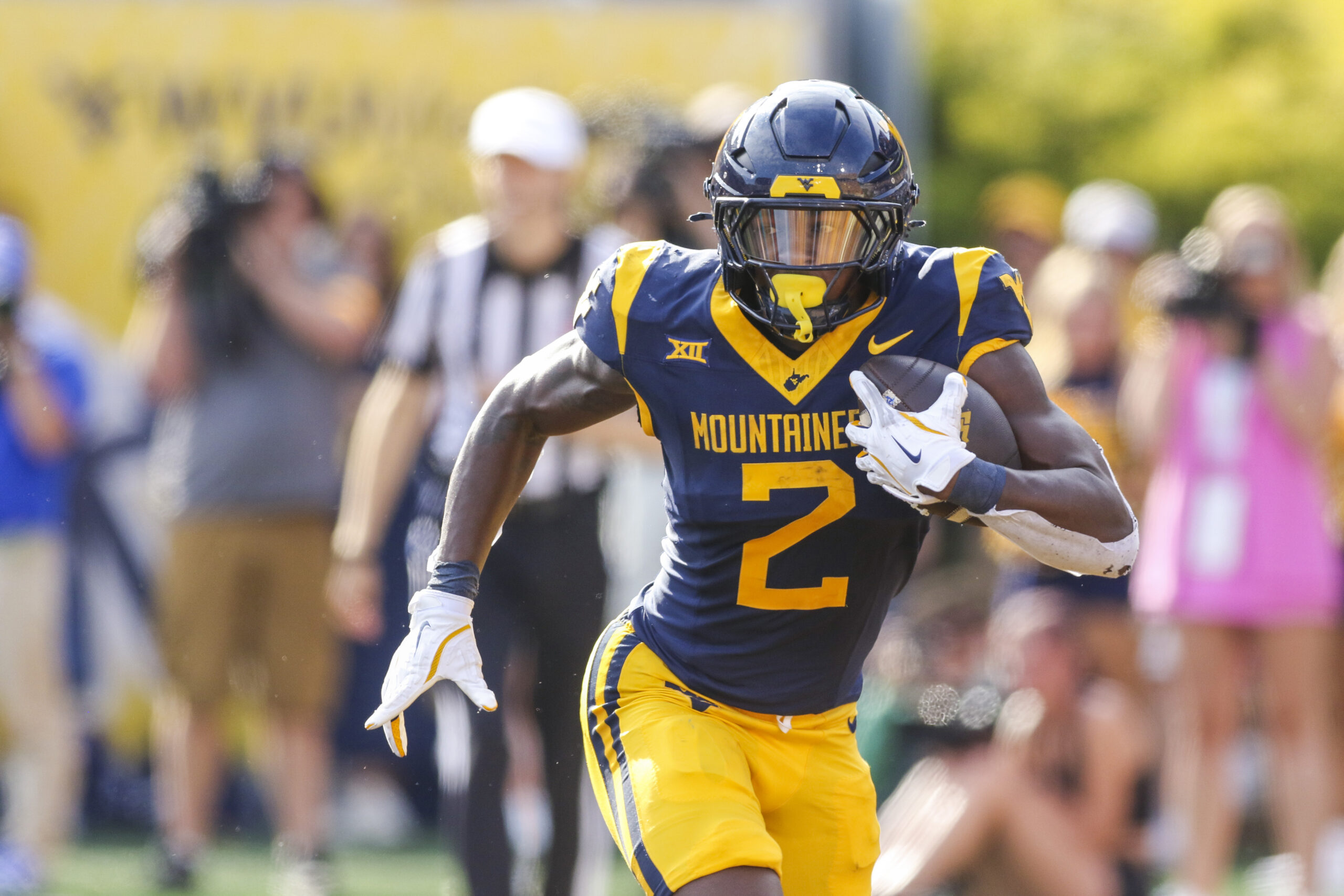 Sep 13, 2025; Morgantown, West Virginia, USA; West Virginia Mountaineers running back Tye Edwards (2) runs the ball during the second quarter against the Pittsburgh Panthers at Milan Puskar Stadium. Mandatory Credit: Ben Queen-Imagn Images