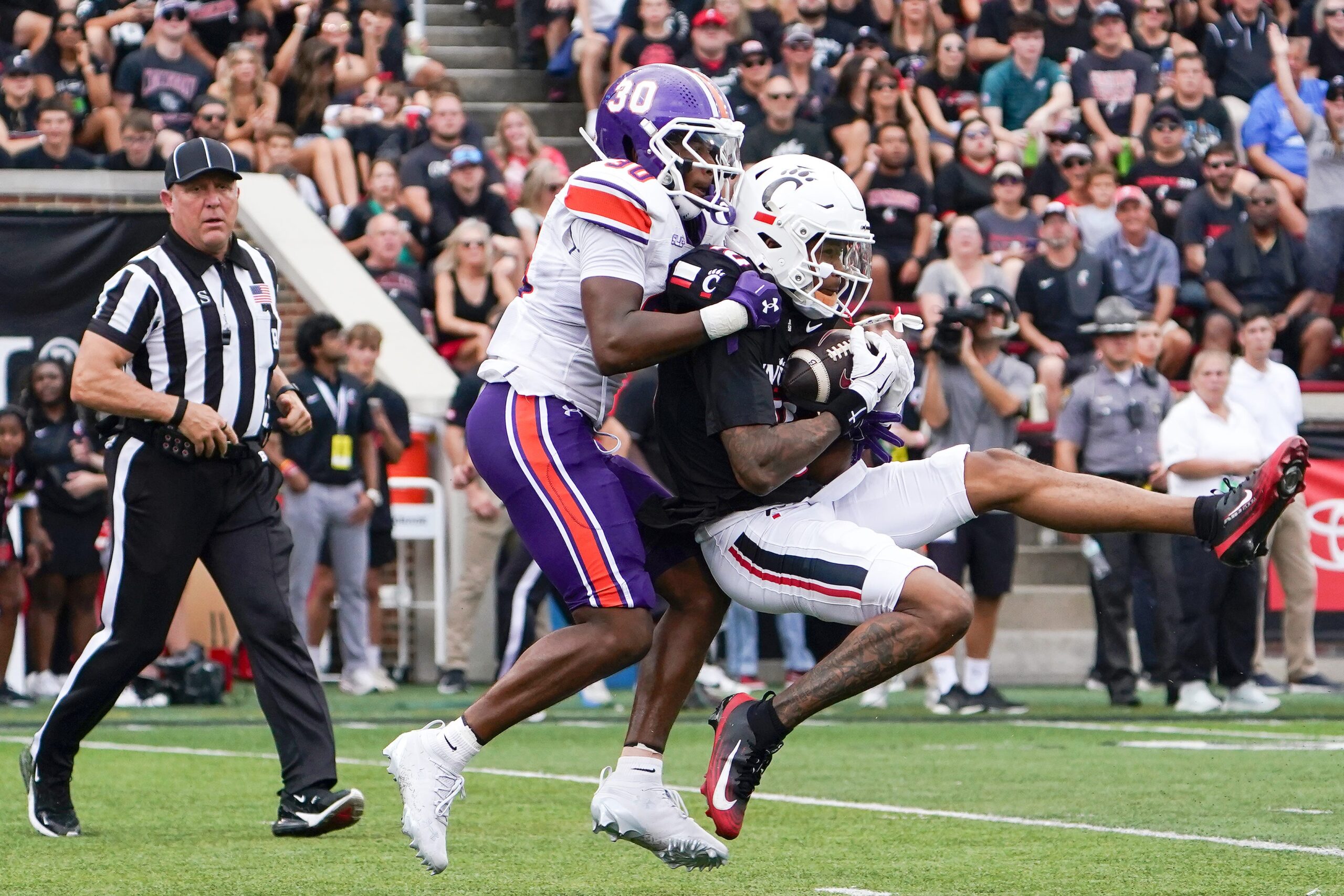 Cincinnati Bearcats wide receiver Caleb Goodie (10) completes a pass in the first quarter of a NCAA men’s college football game between the Cincinnati Bearcats and Northwestern State Demons, Saturday, Sept. 13, 2025, at Nippert Stadium in Cincinnati.