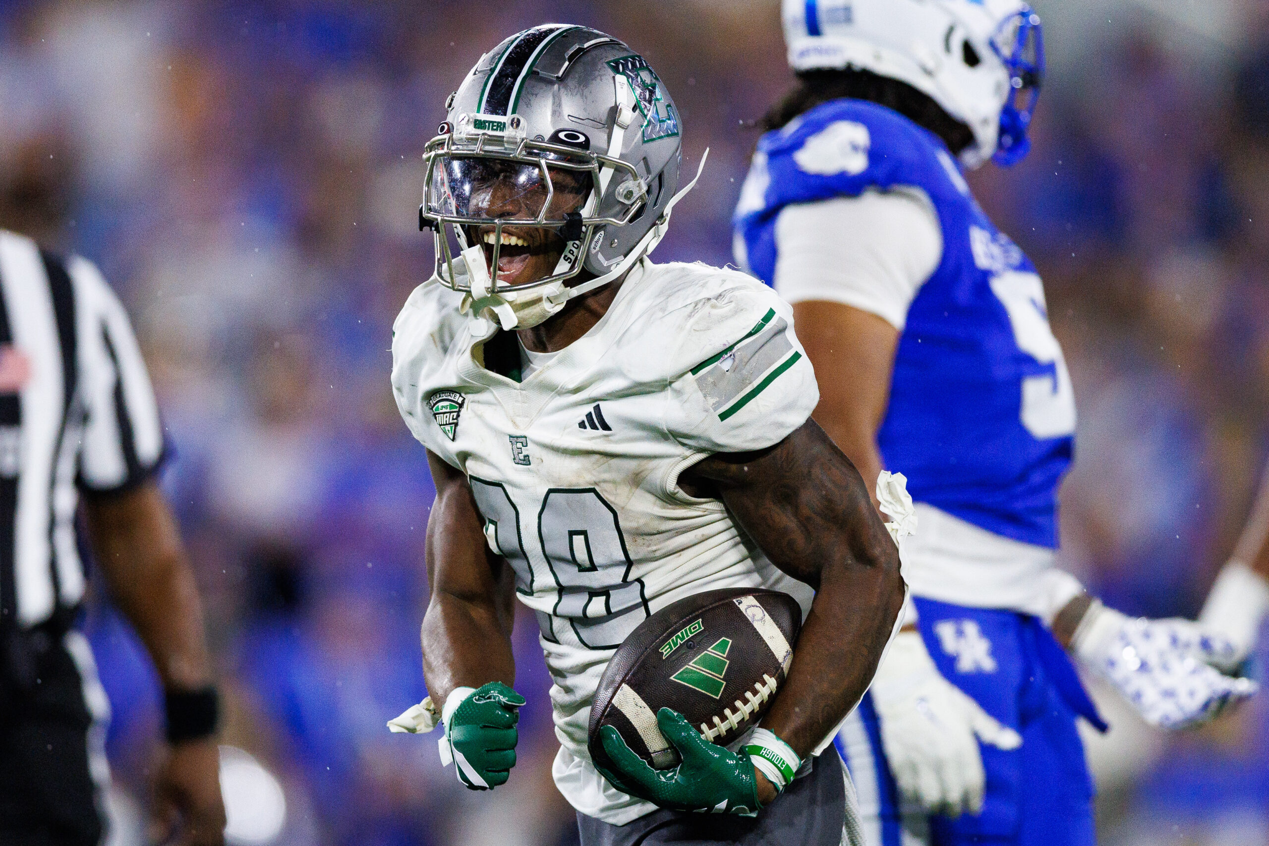 Sep 13, 2025; Lexington, Kentucky, USA; Eastern Michigan Eagles running back Dontae McMillan (28) celebrates after running the ball during the second quarter against the Kentucky Wildcats at Kroger Field. Mandatory Credit: Jordan Prather-Imagn Images