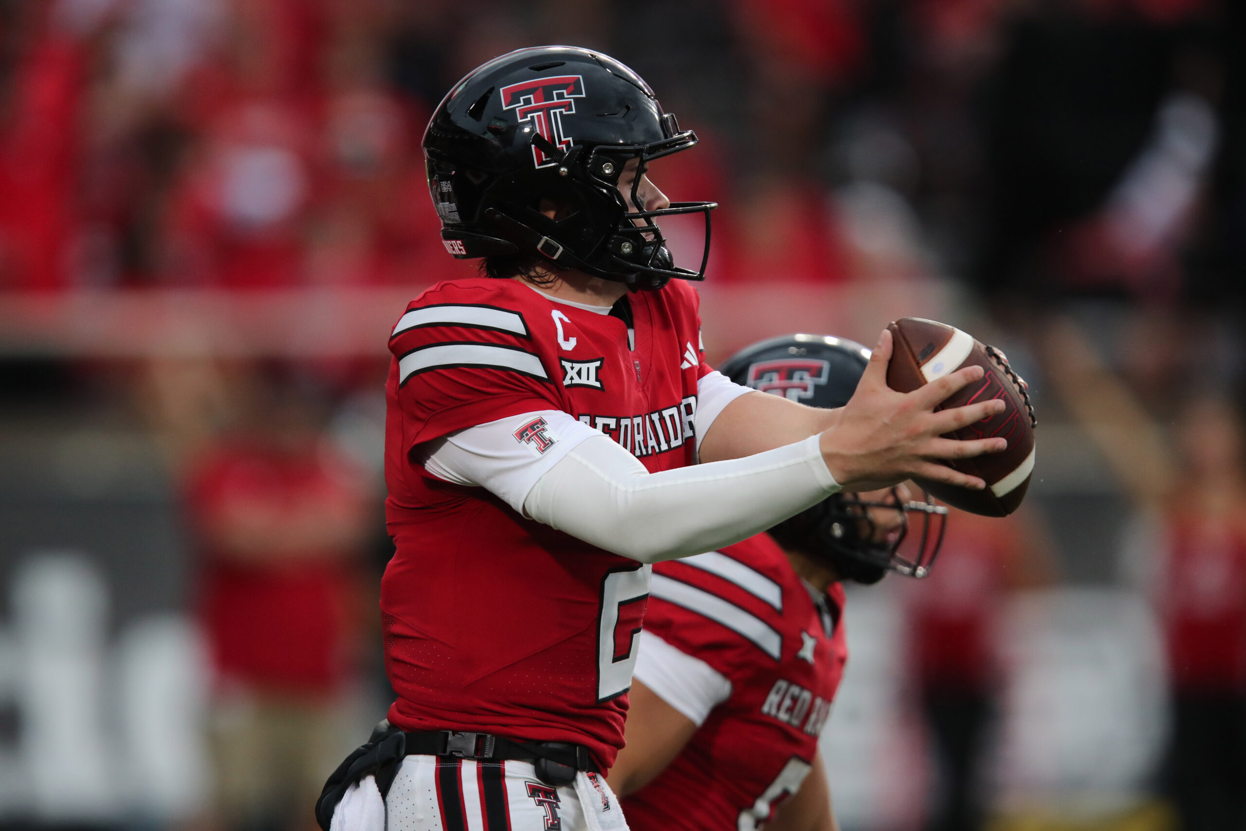 Sep 13, 2025; Lubbock, Texas, USA; Texas Tech Red Raiders quarterback Behren Morton (2) takes a snap in the second half against the Oregon State Beavers at Jones AT&T Stadium. Mandatory Credit: Michael C. Johnson-Imagn Images