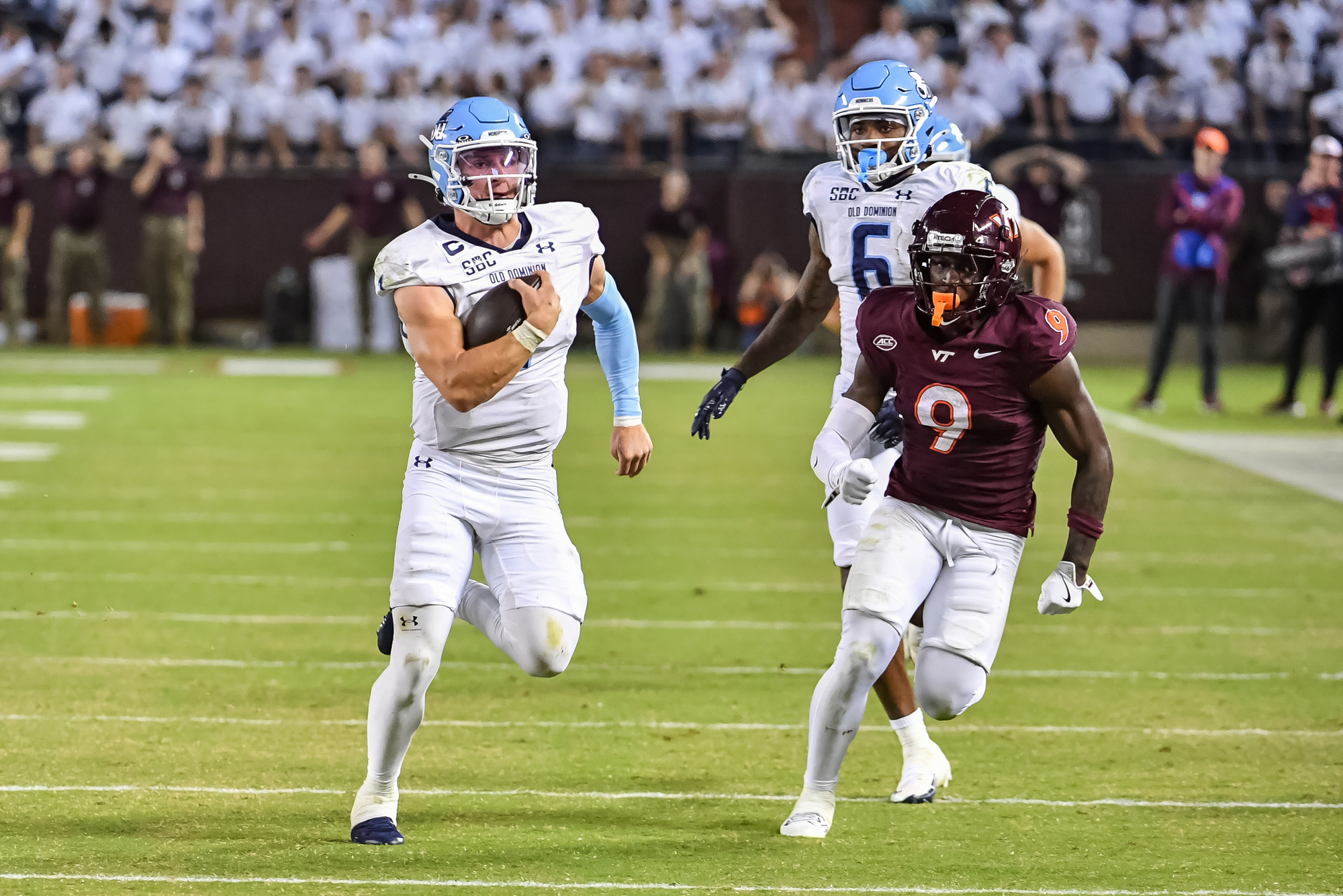 Sep 13, 2025; Blacksburg, Virginia, USA;  Old Dominion Monarchs quarterback Colton Joseph (1) runs the ball as Virginia Tech Hokies cornerback Isaiah Brown-Murray (9) pursues during the third quarter at Lane Stadium. Mandatory Credit: Brian Bishop-Imagn Images