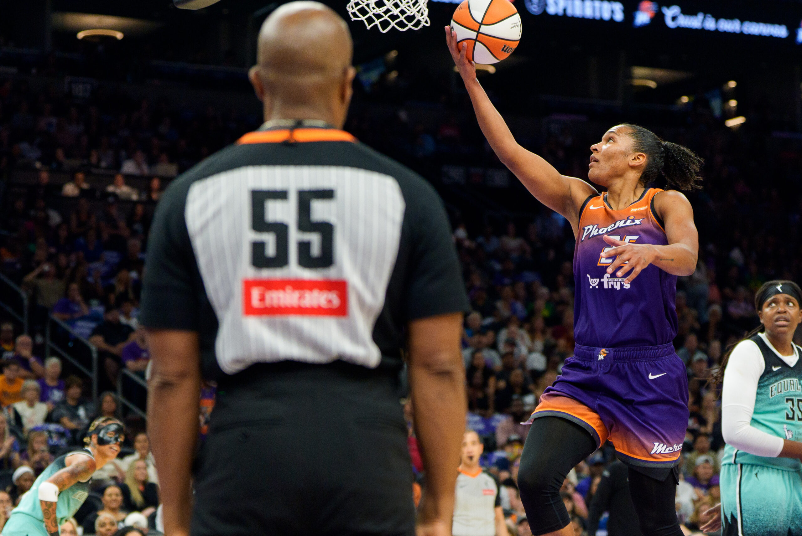 Sep 14, 2025; Phoenix, Arizona, USA; Phoenix Mercury forward Alyssa Thomas (25) drives and scores in the paint during the first half against the New York Liberty during game one of the 2025 WNBA Playoffs round one at PHX Arena. Mandatory Credit: Allan Henry-Imagn Images
