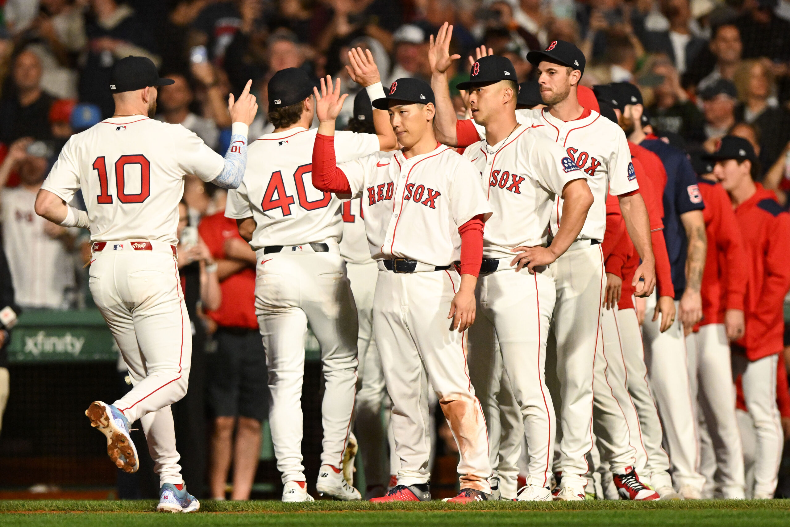 Sep 14, 2025; Boston, Massachusetts, USA; Boston Red Sox shortstop Trevor Story (10) high-fives left fielder Masataka Yoshida (7) after a game against the New York Yankees at Fenway Park. Mandatory Credit: Brian Fluharty-Imagn Images