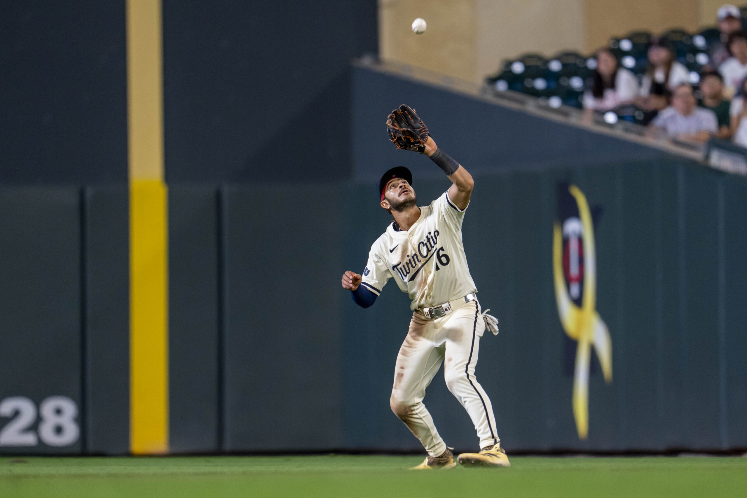 Sep 16, 2025; Minneapolis, Minnesota, USA; Minnesota Twins second baseman Austin Martin (16) catches a fly ball against the New York Yankees in the ninth inning at Target Field. Mandatory Credit: Jesse Johnson-Imagn Images