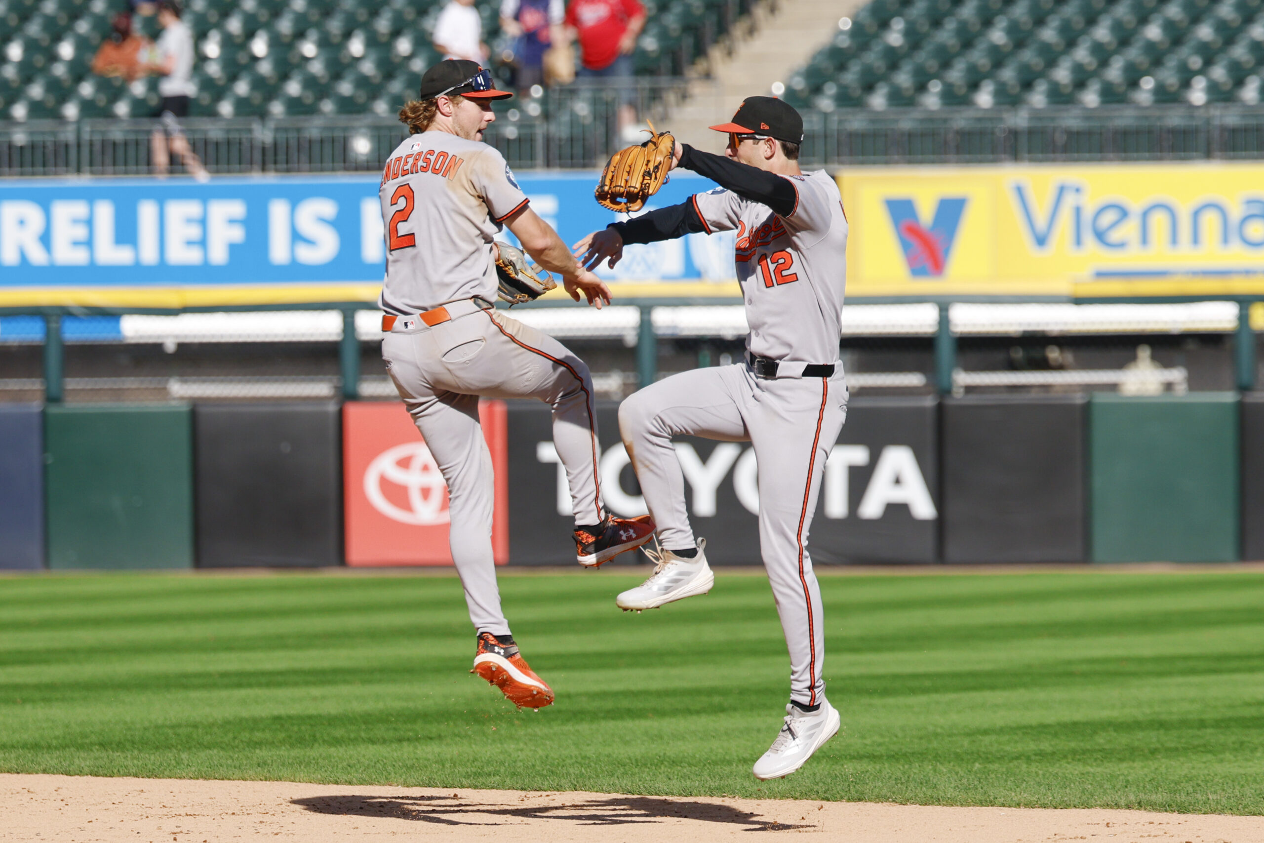 Sep 17, 2025; Chicago, Illinois, USA; Baltimore Orioles shortstop Gunnar Henderson (2) and left fielder Dylan Beavers (12) celebrate team's win against the Chicago White Sox in a baseball game at Rate Field. Mandatory Credit: Kamil Krzaczynski-Imagn Images