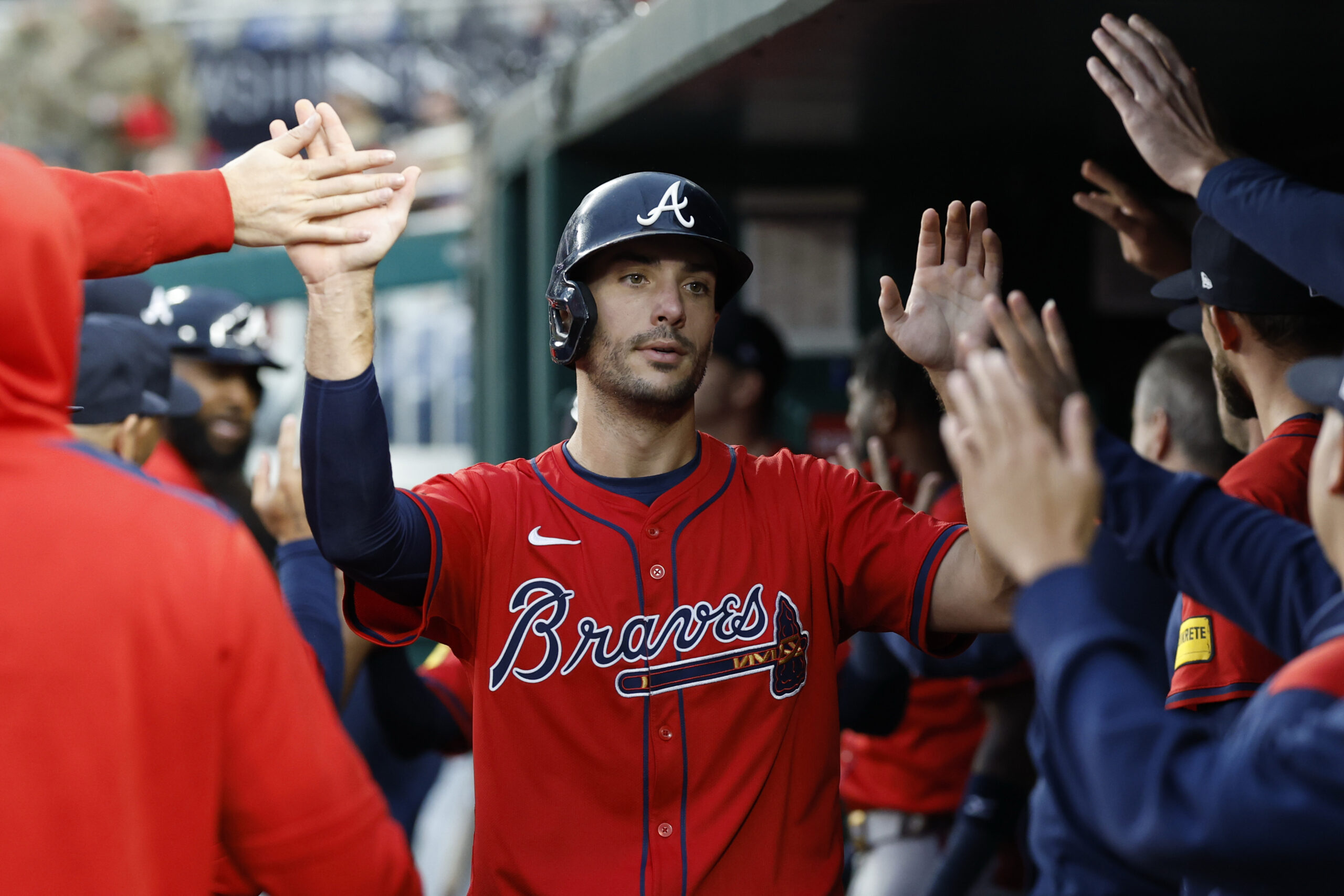 Sep 17, 2025; Washington, District of Columbia, USA; Atlanta Braves first baseman Matt Olson (28) celebrates with teammates in the dugout after scoring a run against the Washington Nationals during the ninth inning at Nationals Park. Mandatory Credit: Geoff Burke-Imagn Images