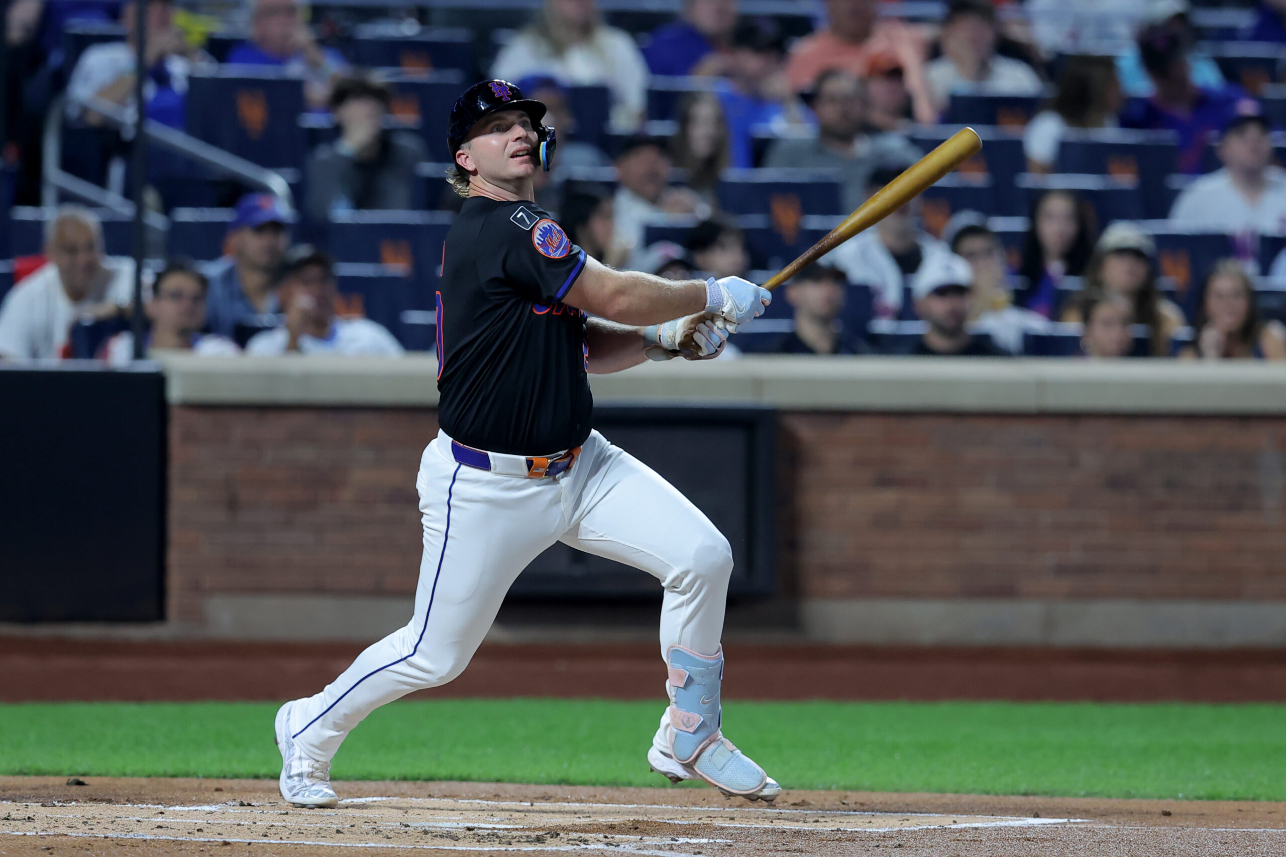 Sep 19, 2025; New York City, New York, USA; New York Mets first baseman Pete Alonso (20) follows through on a single against the Washington Nationals during the first inning at Citi Field. Mets shortstop Francisco Lindor (not pictured) scored on the play on an error by Nationals right fielder Dylan Crews (not pictured). Mandatory Credit: Brad Penner-Imagn Images