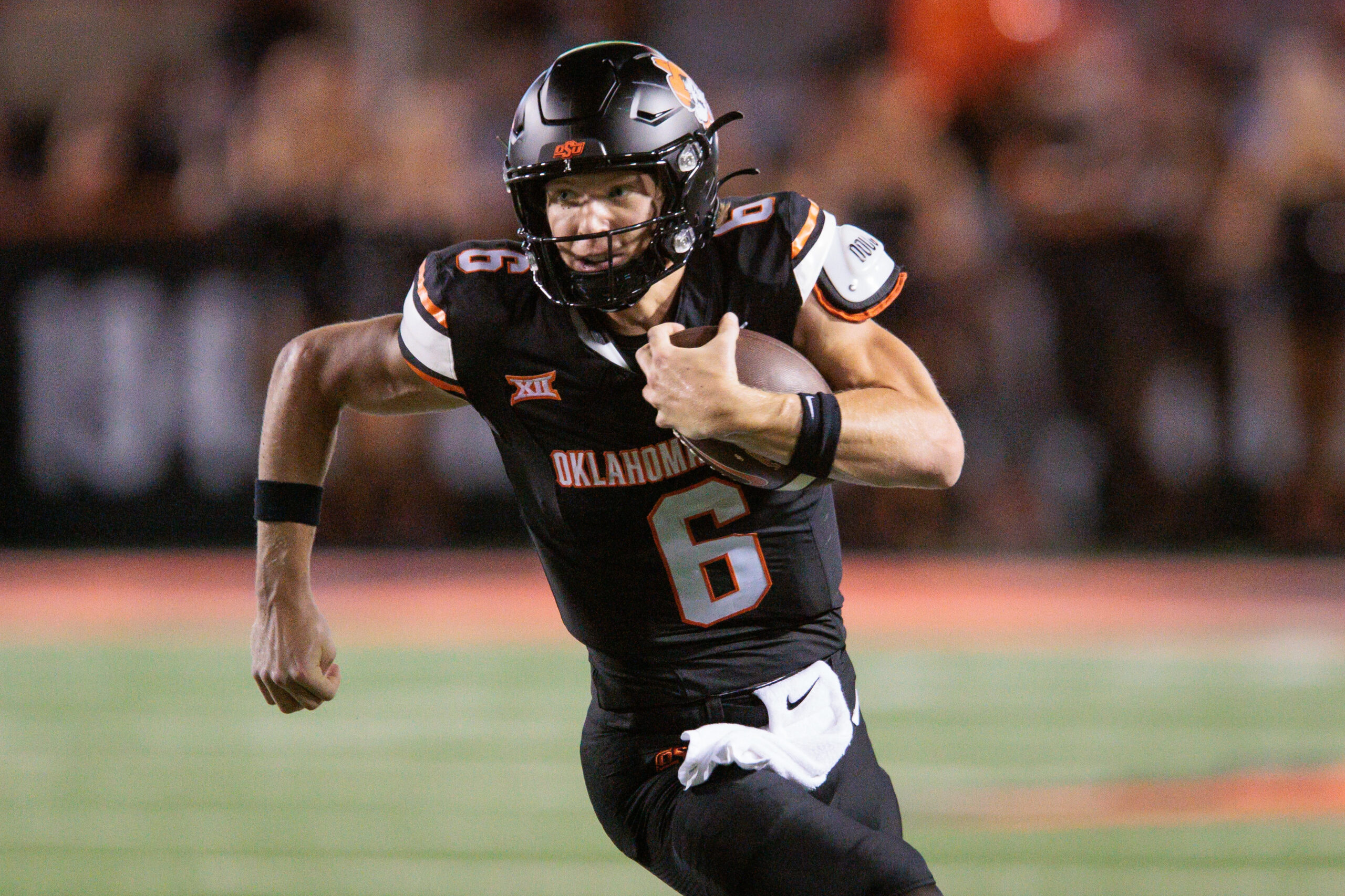 Sep 19, 2025; Stillwater, Oklahoma, USA; Oklahoma State Cowboys quarterback Zane Flores (6) runs the ball during the second half against the Tulsa Golden Hurricane at Boone Pickens Stadium. Mandatory Credit: William Purnell-Imagn Images