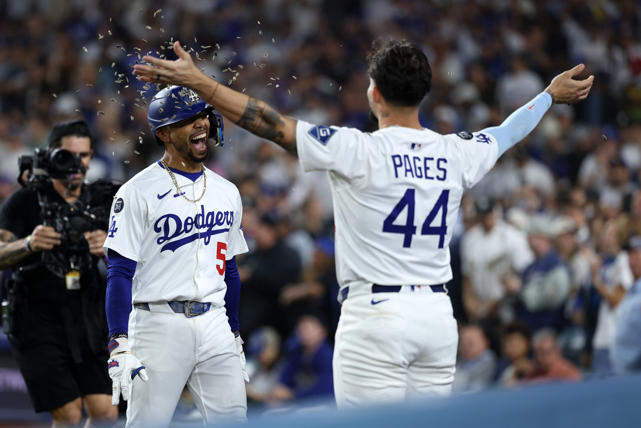 Sep 19, 2025; Los Angeles, California, USA;  Los Angeles Dodgers shortstop Mookie Betts (left) celebrates with center fielder Andy Pages (44) after hitting a solo home run during the fifth inning against the San Francisco Giants at Dodger Stadium. Mandatory Credit: Kiyoshi Mio-Imagn Images