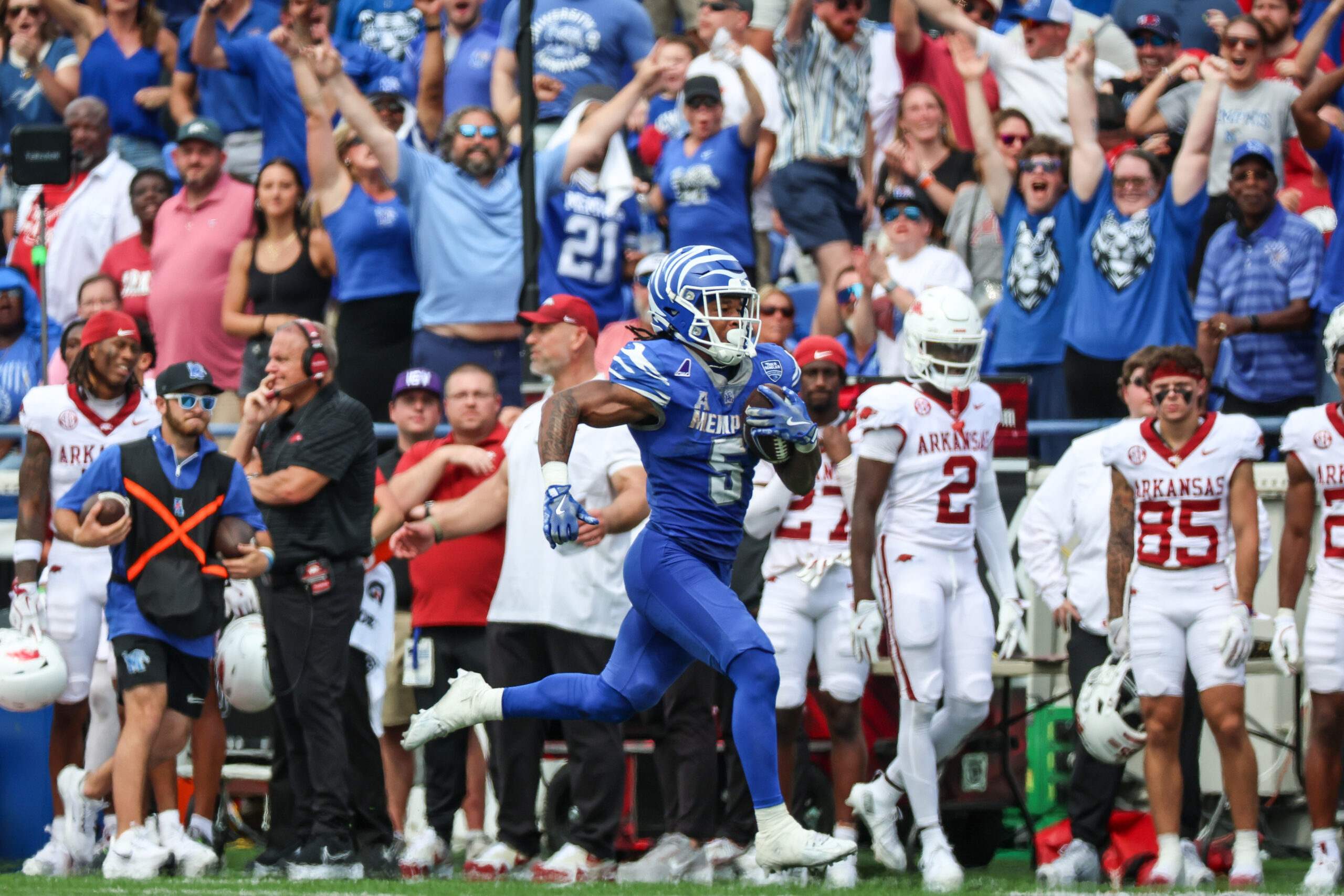 Sep 20, 2025; Memphis, Tennessee, USA; Memphis Tigers running back Sutton Smith (5) runs for a touchdown against the Arkansas Razorbacks during the second half at Simmons Bank Liberty Stadium. Mandatory Credit: Wesley Hale-Imagn Images