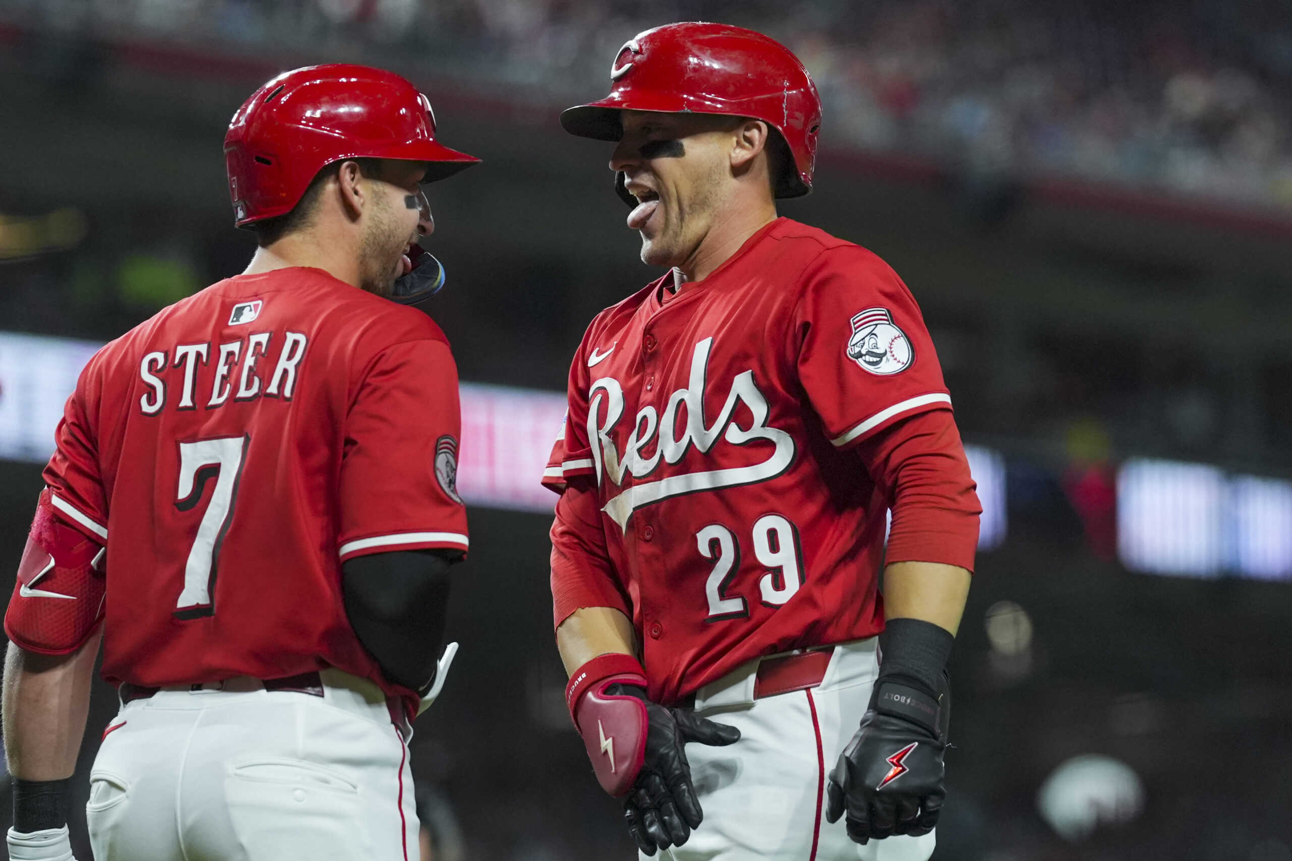 Sep 20, 2025; Cincinnati, Ohio, USA; Cincinnati Reds outfielder TJ Friedl (29) celebrates with first baseman Spencer Steer (7) after hitting a solo home run against the Chicago Cubs in the seventh inning at Great American Ball Park. Mandatory Credit: Aaron Doster-Imagn Images