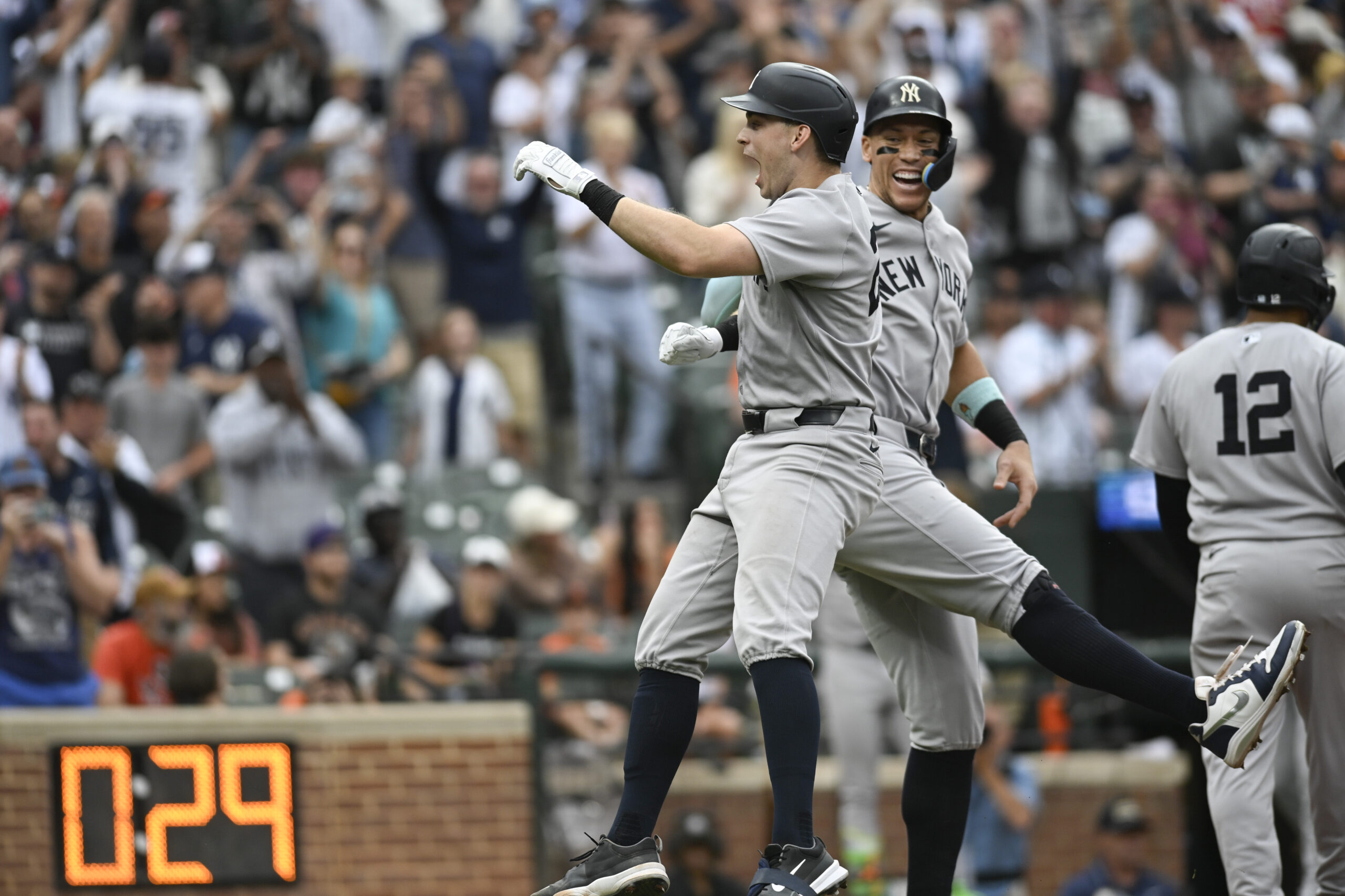 Sep 21, 2025; Baltimore, Maryland, USA; New York Yankees first base Ben Rice (22) celebrates with designated hitter Aaron Judge (99) at home plate after hitting a tenth inning grand slam against the Baltimore Orioles at Oriole Park at Camden Yards. Mandatory Credit: Tommy Gilligan-Imagn Images