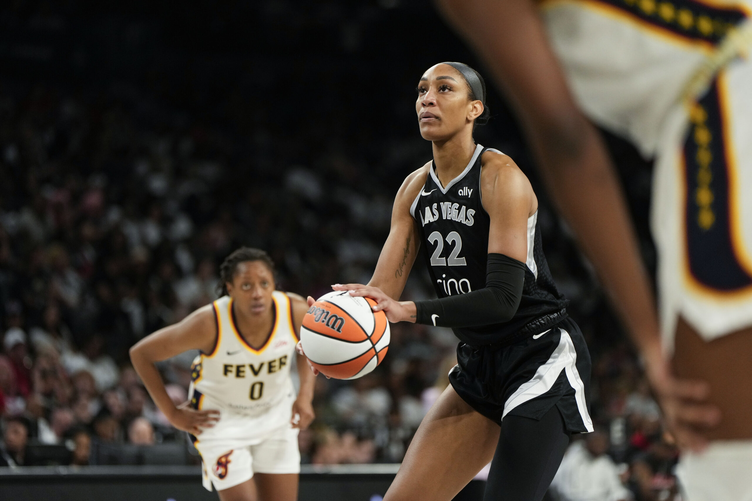 Sep 21, 2025; Las Vegas, Nevada, USA; Las Vegas Aces center A'ja Wilson (22) shoots a free throw during the third quarter in game one of the second round for the 2025 WNBA Playoffs against the Indiana Fever at Michelob Ultra Arena. Mandatory Credit: Lucas Peltier-Imagn Images