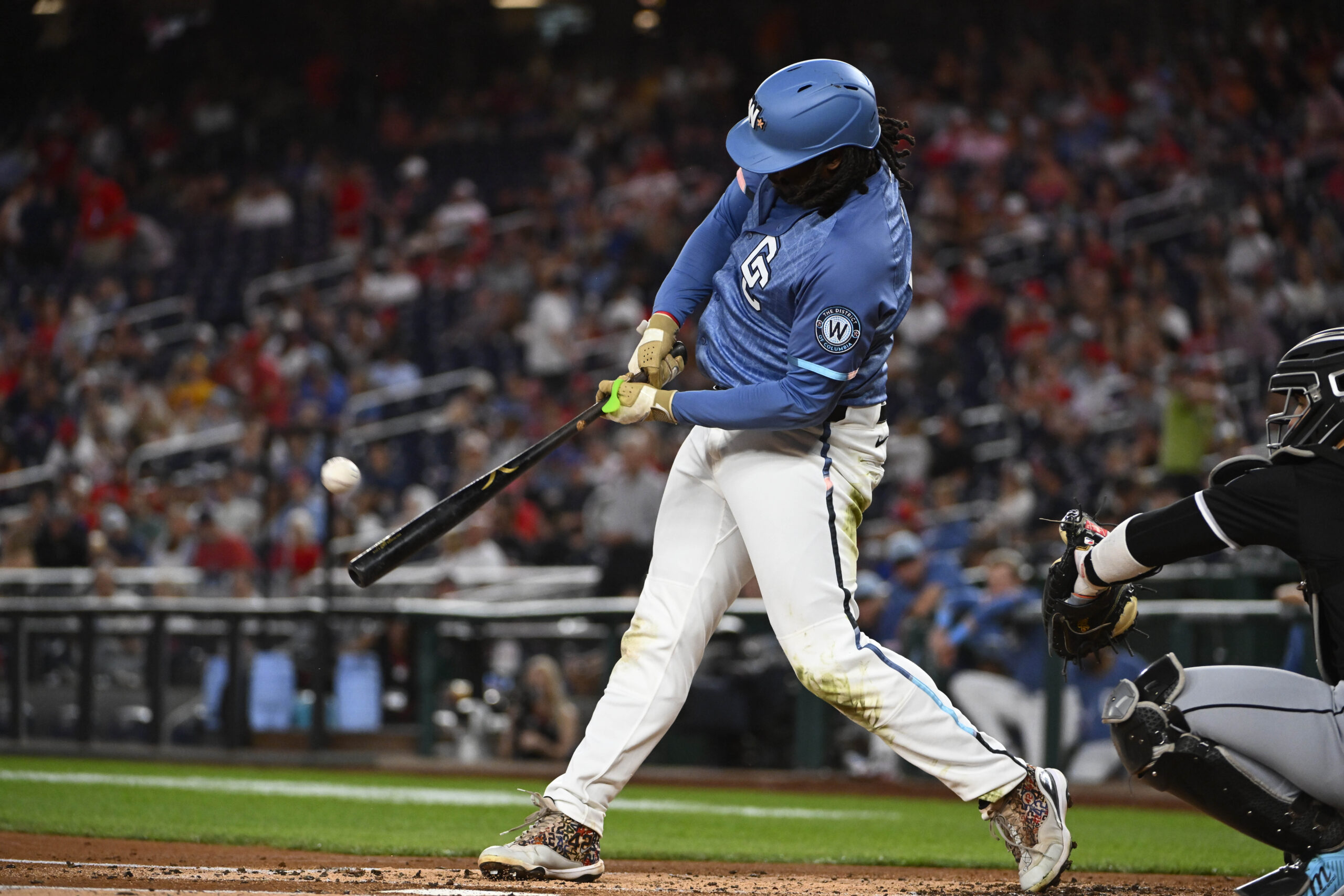 Sep 26, 2025; Washington, District of Columbia, USA; Washington Nationals first baseman Josh Bell (19) hits a solo home run against the Chicago White Sox during the first inning at Nationals Park. Mandatory Credit: Brad Mills-Imagn Images