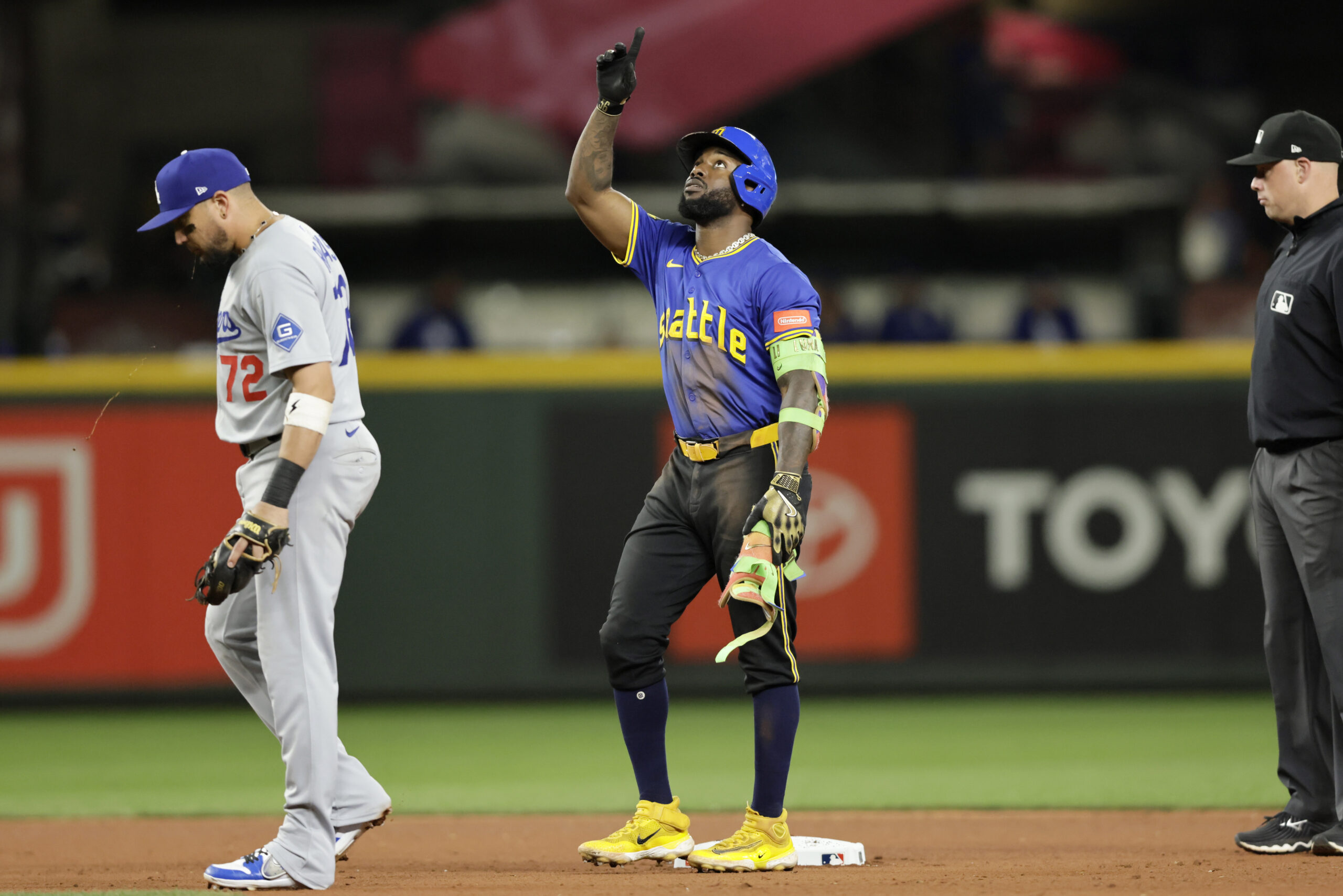 Sep 26, 2025; Seattle, Washington, USA; Seattle Mariners left fielder Randy Arozarena (56) points reaching second on a double against the Los Angeles Dodgers during the seventh inning at T-Mobile Park. Mandatory Credit: John Froschauer-Imagn Images