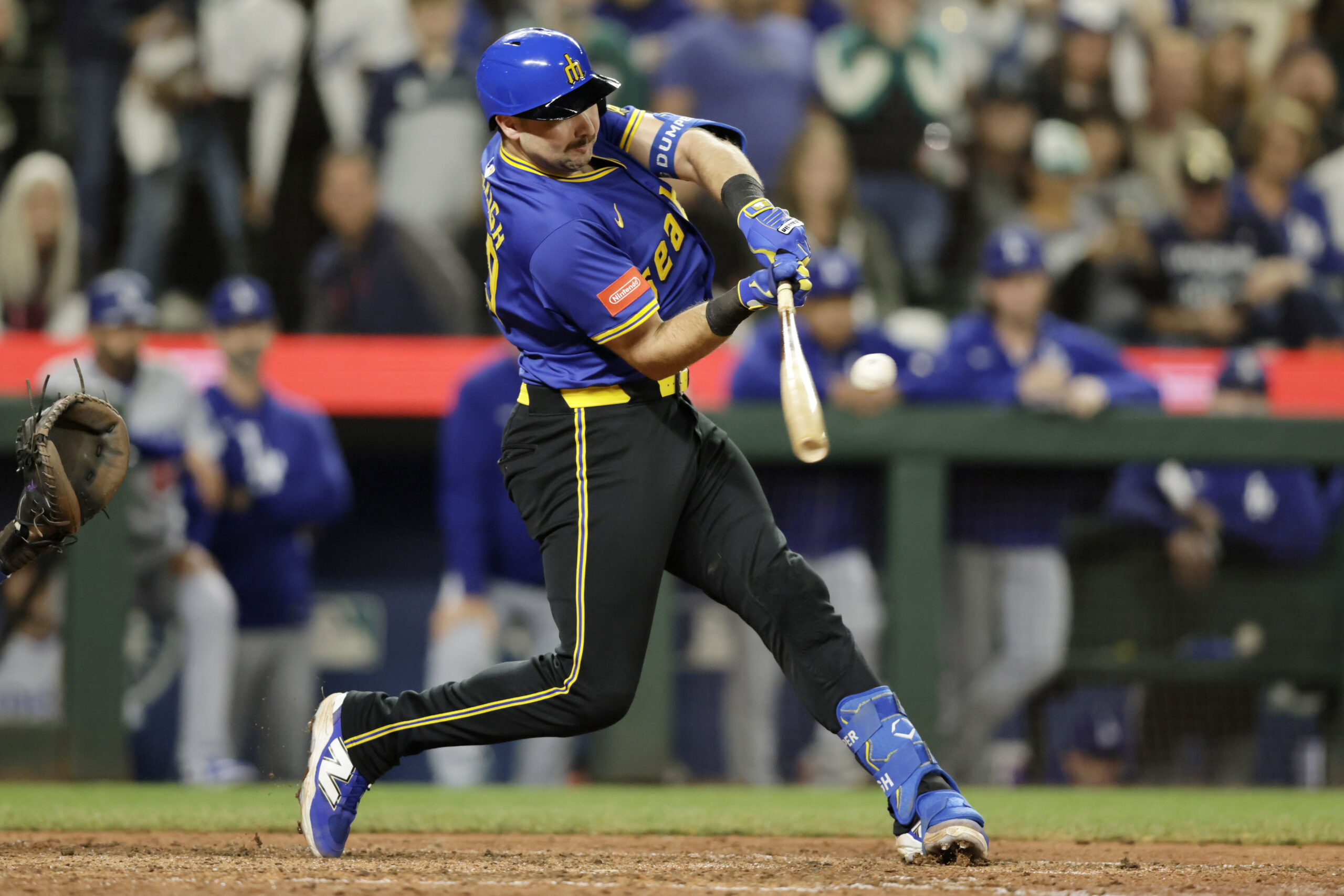 Sep 26, 2025; Seattle, Washington, USA; Seattle Mariners catcher Cal Raleigh (29) hits a double against the Los Angeles Dodgers during the ninth inning at T-Mobile Park. Mandatory Credit: John Froschauer-Imagn Images
