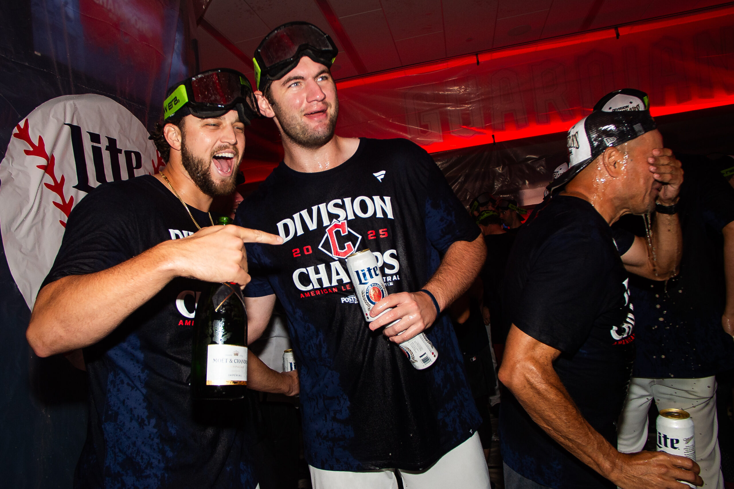 Sep 28, 2025; Cleveland, Ohio, USA;  Cleveland Guardians starting pitcher Slade Cecconi (44) and starting pitcher Gavin Williams, middle, celebrate after the Guardians won the American League Central Division at Progressive Field. Mandatory Credit: Ken Blaze-Imagn Images