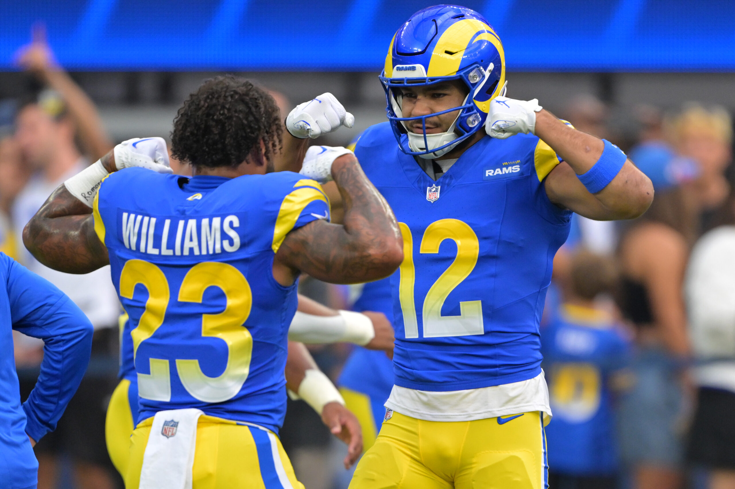 Sep 28, 2025; Inglewood, California, USA; Los Angeles Rams running back Kyren Williams (23) and wide receiver Puka Nacua (12) flex as they get ready for the game against the Indianapolis Colts at SoFi Stadium. Mandatory Credit: Jayne Kamin-Oncea-Imagn Images
