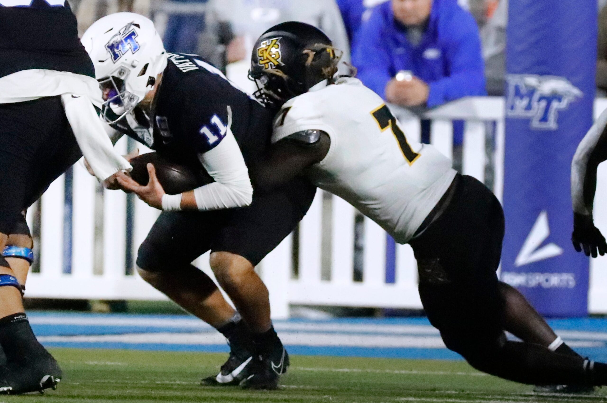 Middle Tennessee quarterback Nicholas Vattiato (11) gets sacked by Kennesaw State linebacker Garland Benyard (7) during the football game at MTSU, on Tuesday, Oct. 15, 2024.