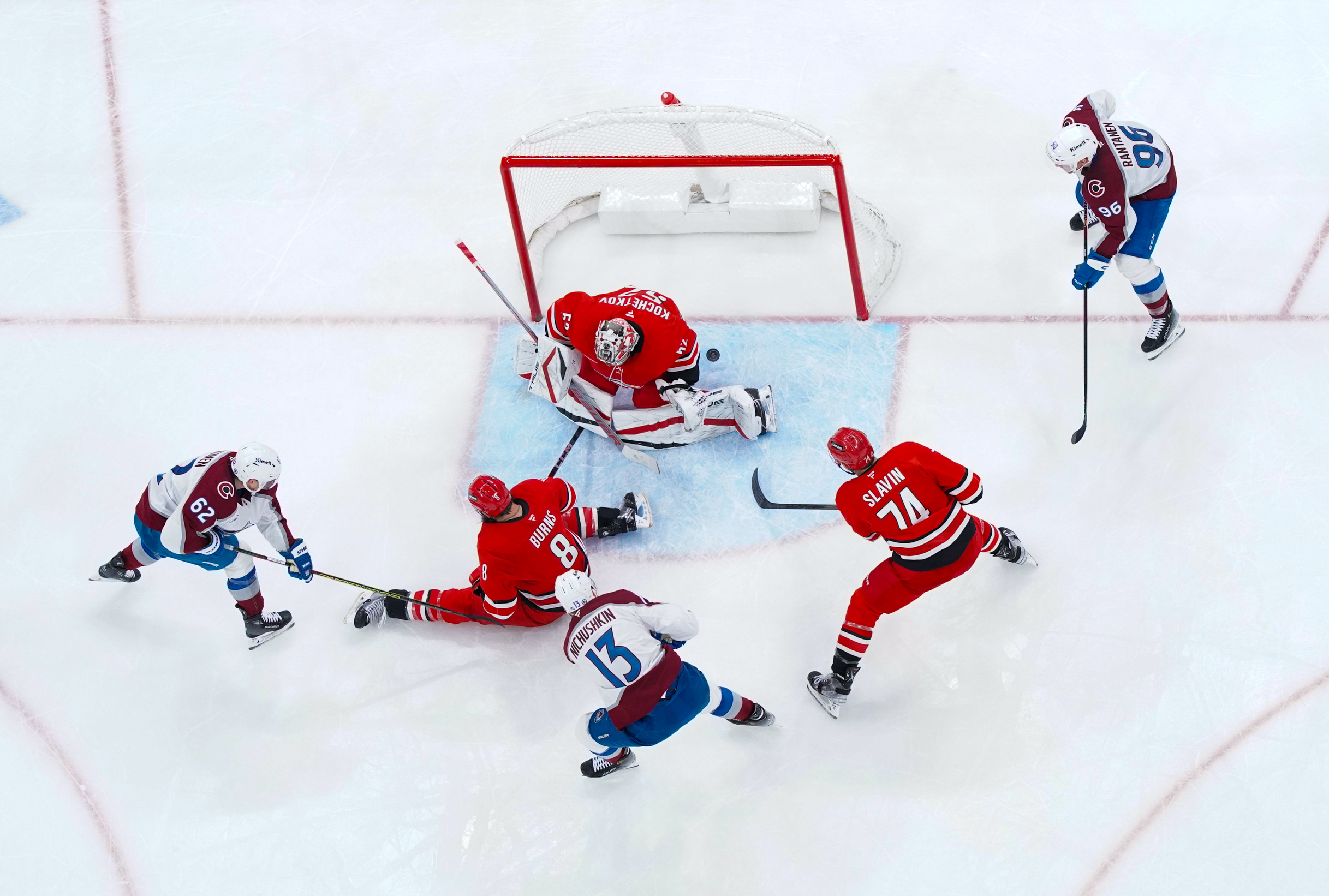 Dec 5, 2024; Raleigh, North Carolina, USA; Colorado Avalanche right wing Valeri Nichushkin (13) scores a goal past Carolina Hurricanes goaltender Pyotr Kochetkov (52) defenseman Brent Burns (8) and defenseman Jaccob Slavin (74) during the third period at Lenovo Center. Mandatory Credit: James Guillory-Imagn Images