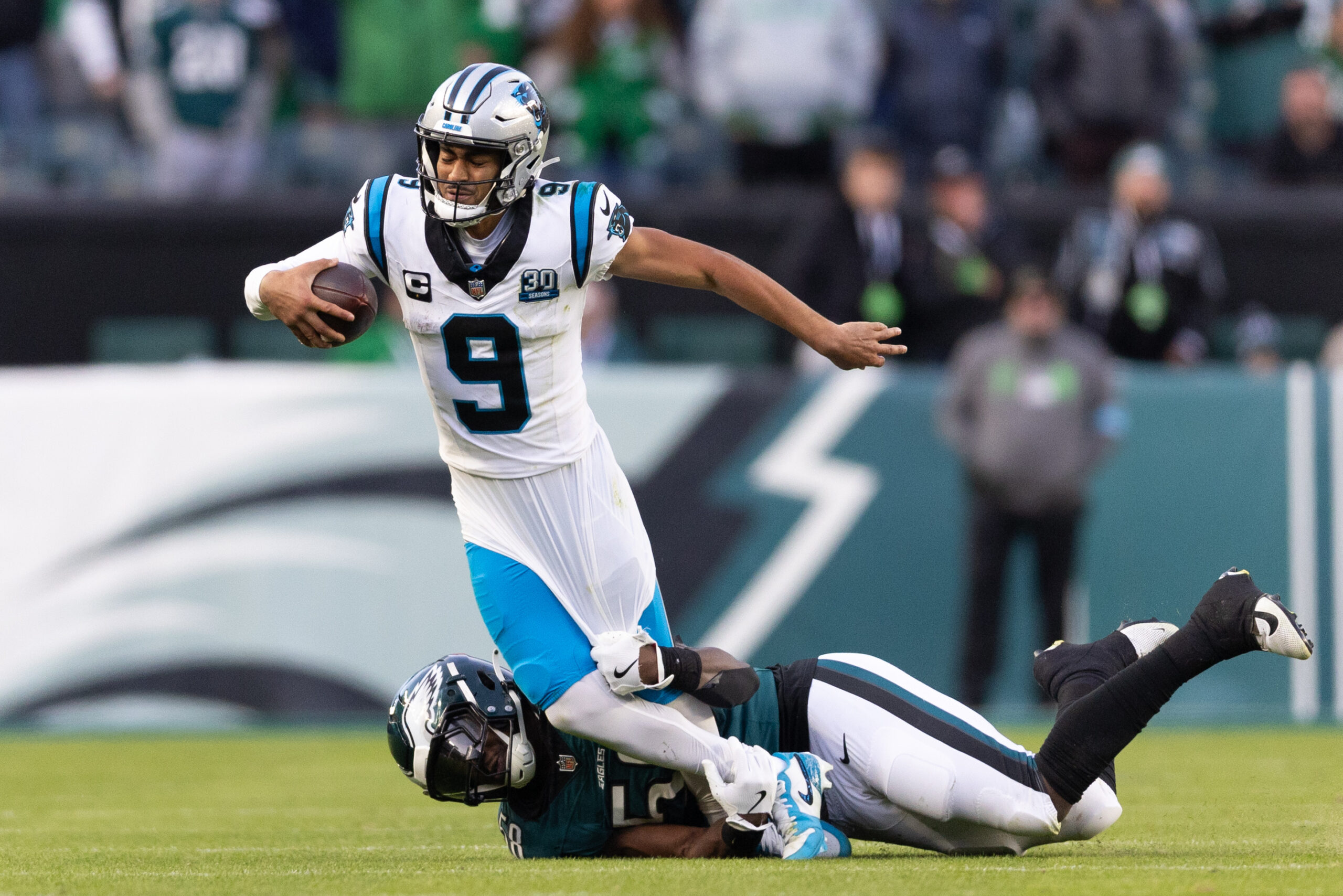 Dec 8, 2024; Philadelphia, Pennsylvania, USA; Philadelphia Eagles linebacker Jalyx Hunt (58) tackles Carolina Panthers quarterback Bryce Young (9) during the fourth quarter at Lincoln Financial Field. Mandatory Credit: Bill Streicher-Imagn Images