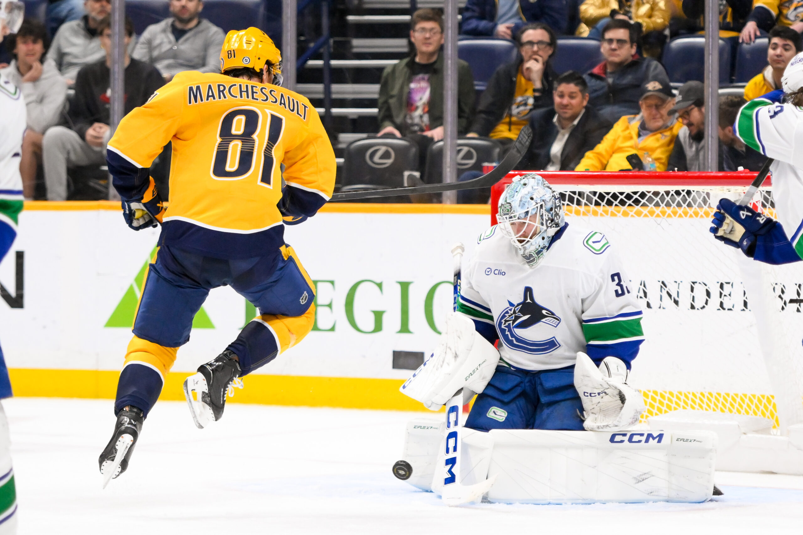 Jan 29, 2025; Nashville, Tennessee, USA; Vancouver Canucks goaltender Thatcher Demko (35) blocks the shot of Nashville Predators center Jonathan Marchessault (81) during the third period at Bridgestone Arena. Mandatory Credit: Steve Roberts-Imagn Images