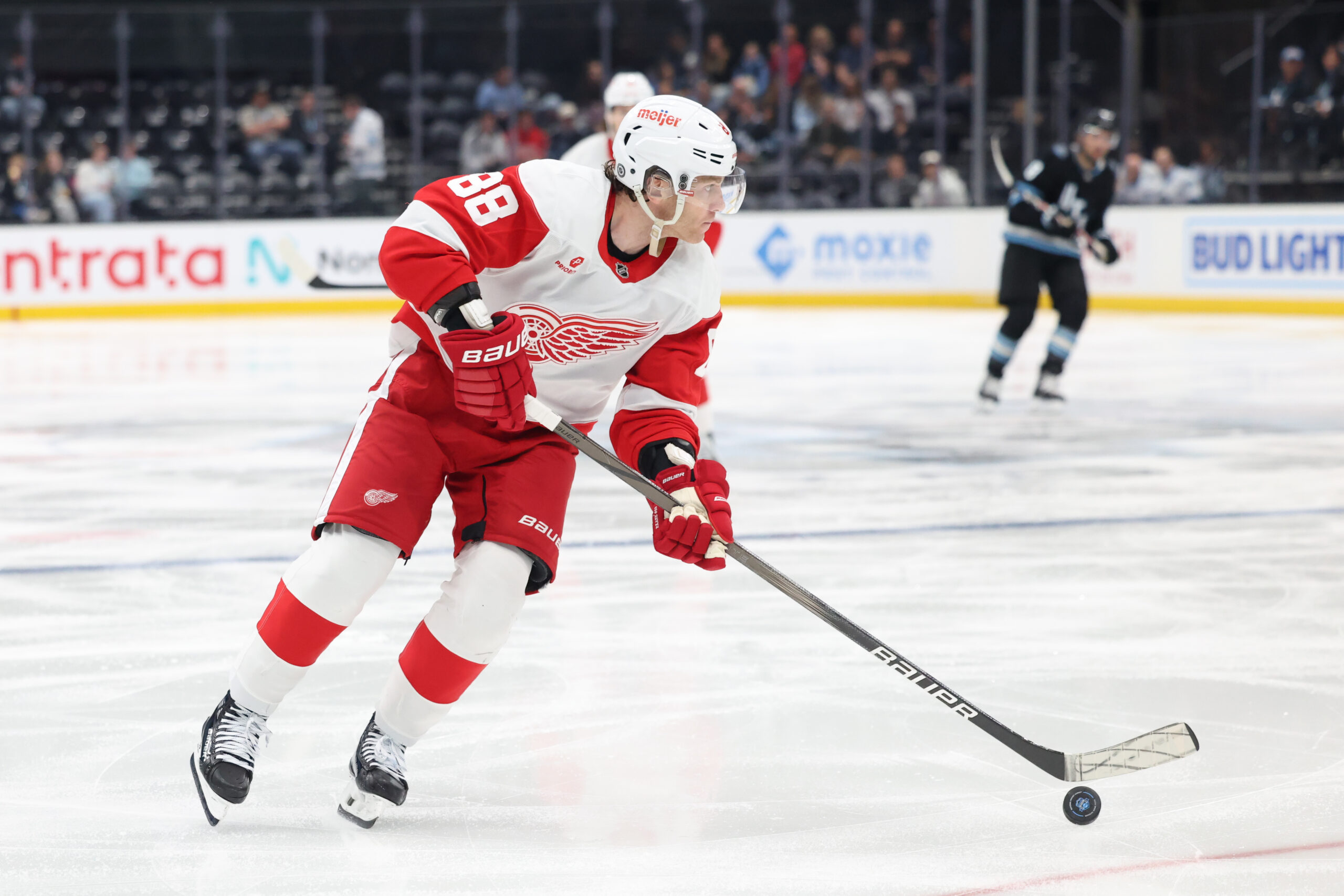 Mar 24, 2025; Salt Lake City, Utah, USA; Detroit Red Wings right wing Patrick Kane (88) skates with the puck against the Utah Hockey Club during the second period at Delta Center. Mandatory Credit: Rob Gray-Imagn Images