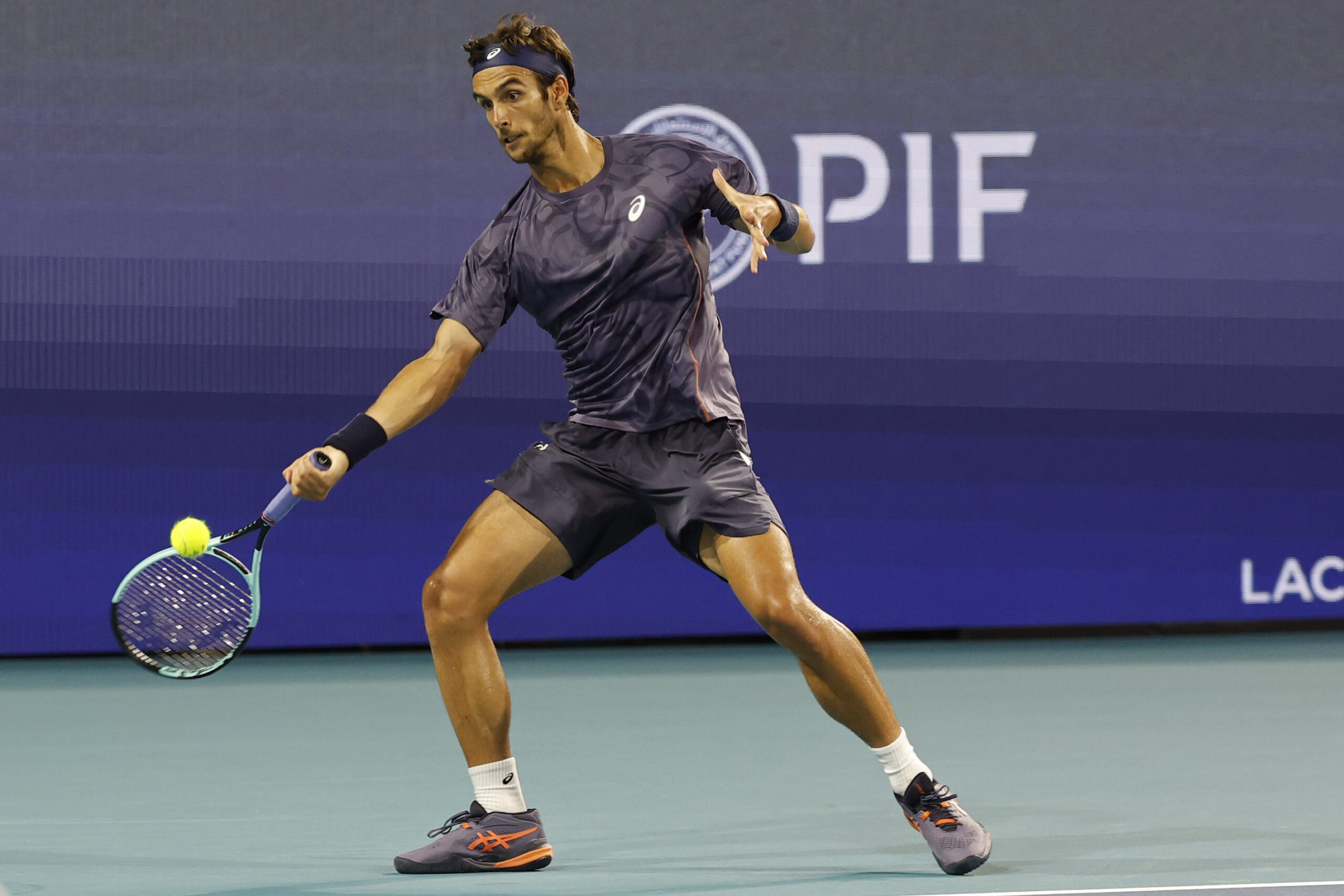 Mar 25, 2025; Miami, FL, USA; Lorenzo Musetti (ITA) hits a forehand against Novak Djokovic (SRB)(not pictured) on day eight of the Miami Open at Hard Rock Stadium. Mandatory Credit: Geoff Burke-Imagn Images