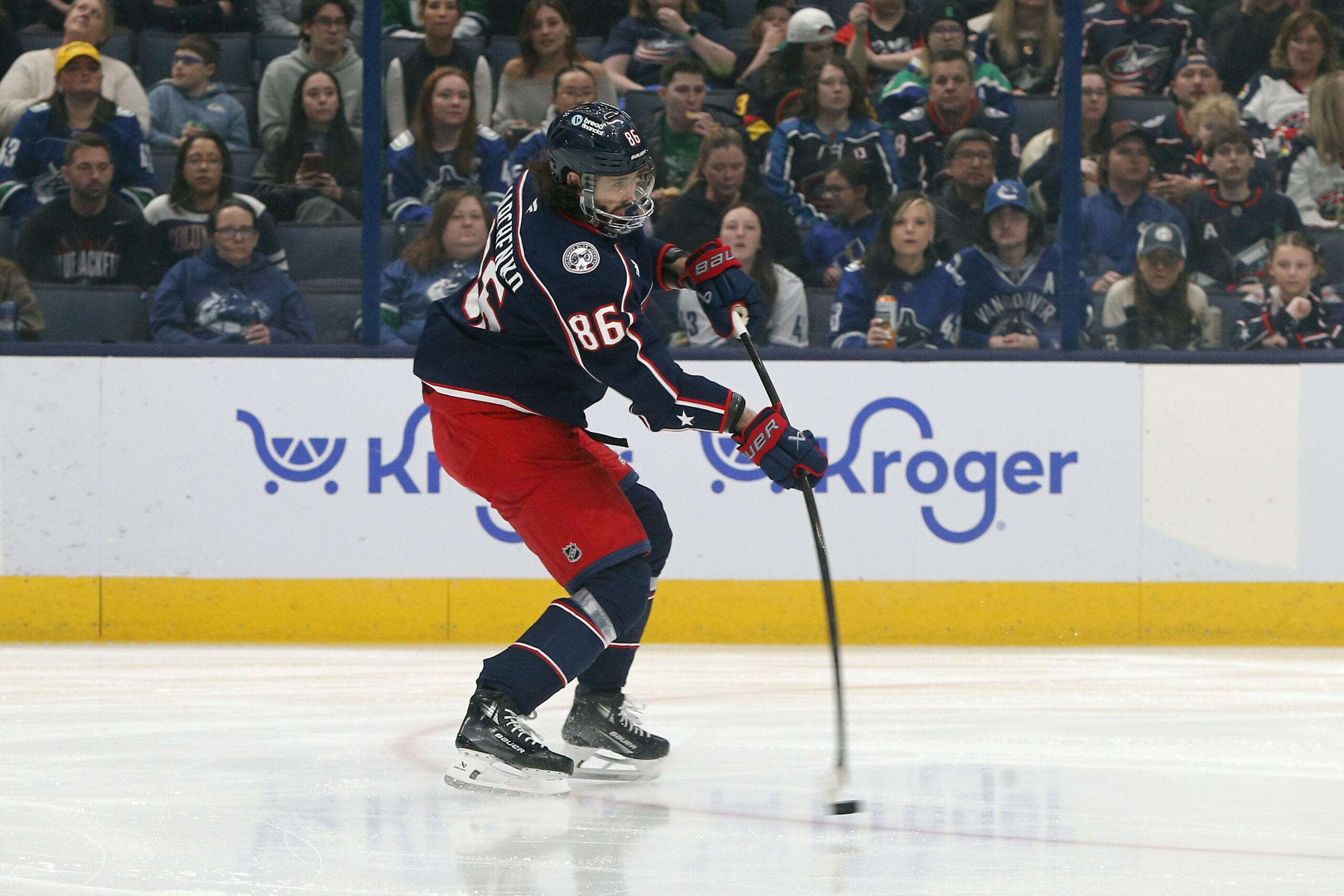 Mar 28, 2025; Columbus, Ohio, USA; Columbus Blue Jackets right wing Kirill Marchenko (86) wrists a shot on goal against the Vancouver Canucks during the first period at Nationwide Arena. Mandatory Credit: Russell LaBounty-Imagn Images
