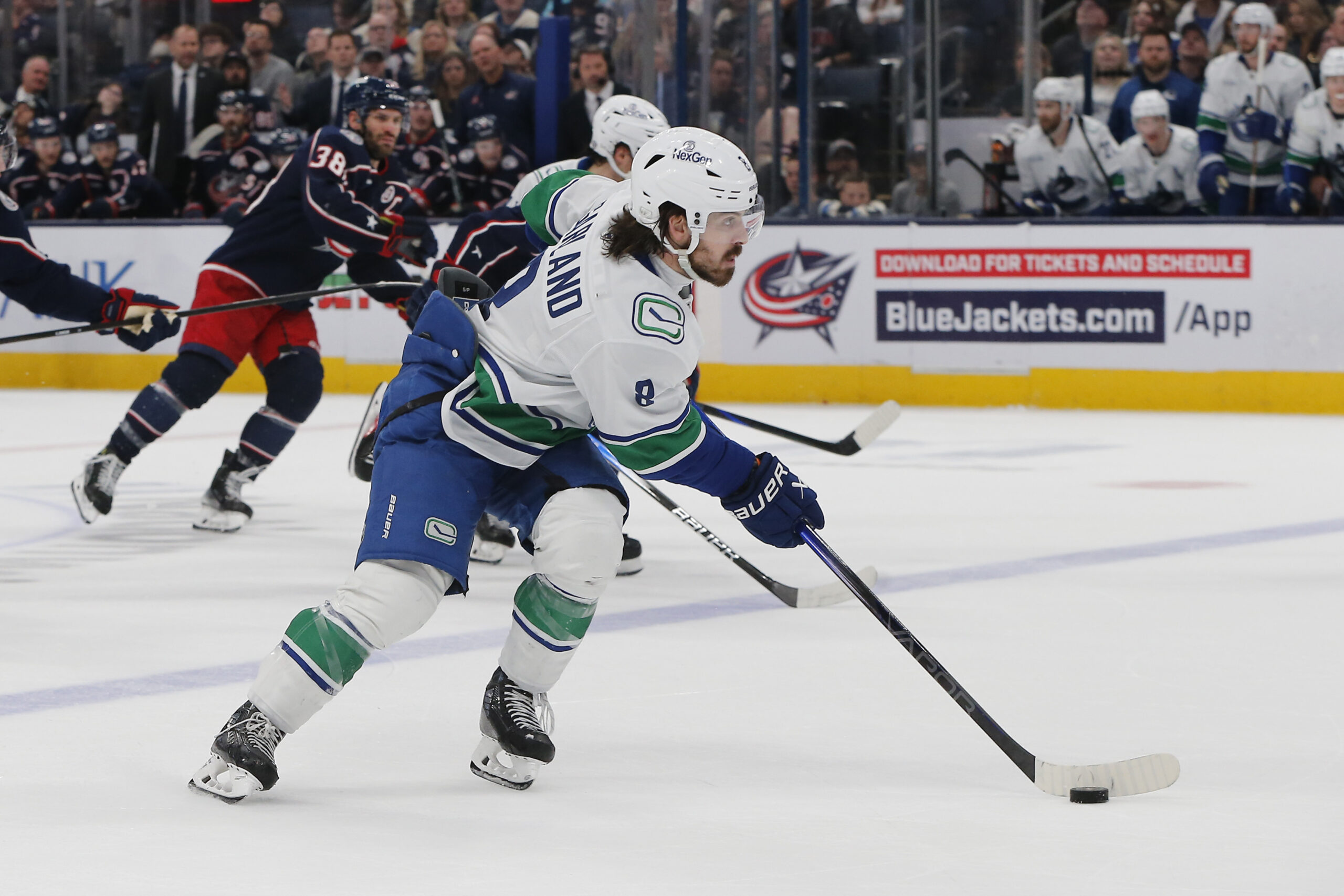 Mar 28, 2025; Columbus, Ohio, USA; Vancouver Canucks right wing Conor Garland (8) carries the puck against the Columbus Blue Jackets during the second period at Nationwide Arena. Mandatory Credit: Russell LaBounty-Imagn Images