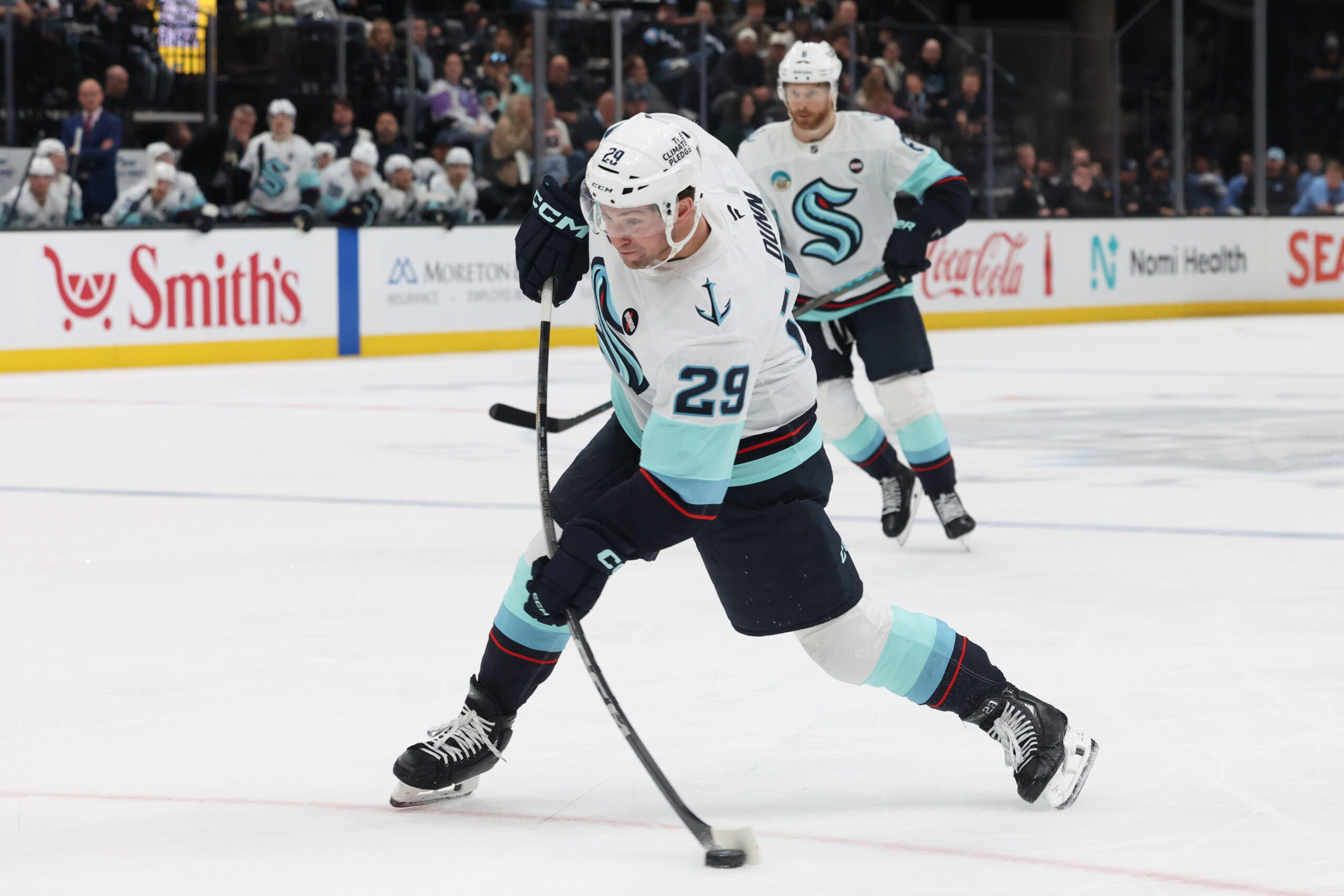 Apr 8, 2025; Salt Lake City, Utah, USA; Seattle Kraken defenseman Vince Dunn (29) takes a shot against the Utah Hockey Club during the third period at Delta Center. Mandatory Credit: Rob Gray-Imagn Images