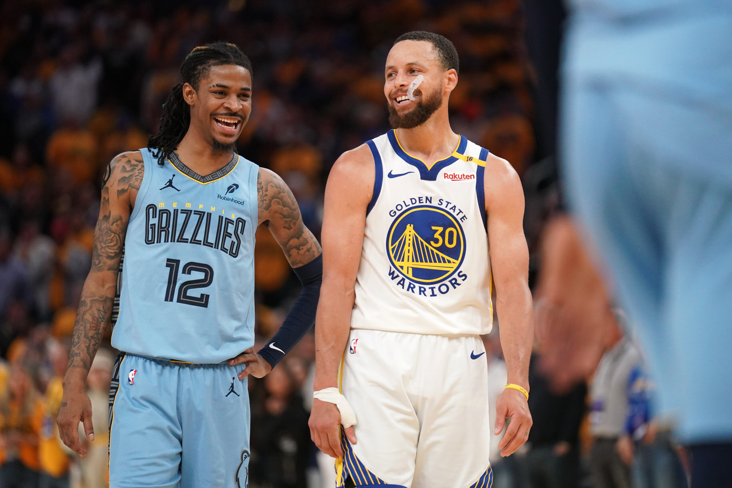 Apr 15, 2025; San Francisco, California, USA; Memphis Grizzlies guard Ja Morant (12) talks with Golden State Warriors guard Stephen Curry (30) in between free throw by Curry in the fourth quarter at the Chase Center. Mandatory Credit: Cary Edmondson-Imagn Images