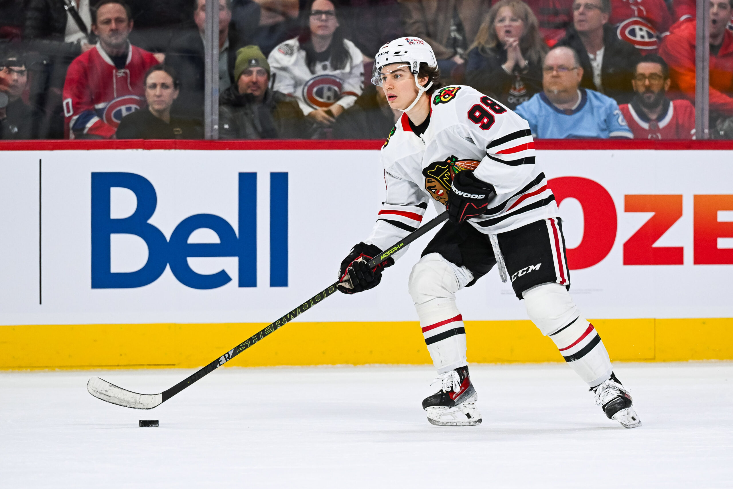 Apr 14, 2025; Montreal, Quebec, CAN; Chicago Blackhawks center Connor Bedard (98) plays the puck against the Montreal Canadiens in the first period at Bell Centre. Mandatory Credit: David Kirouac-Imagn Images