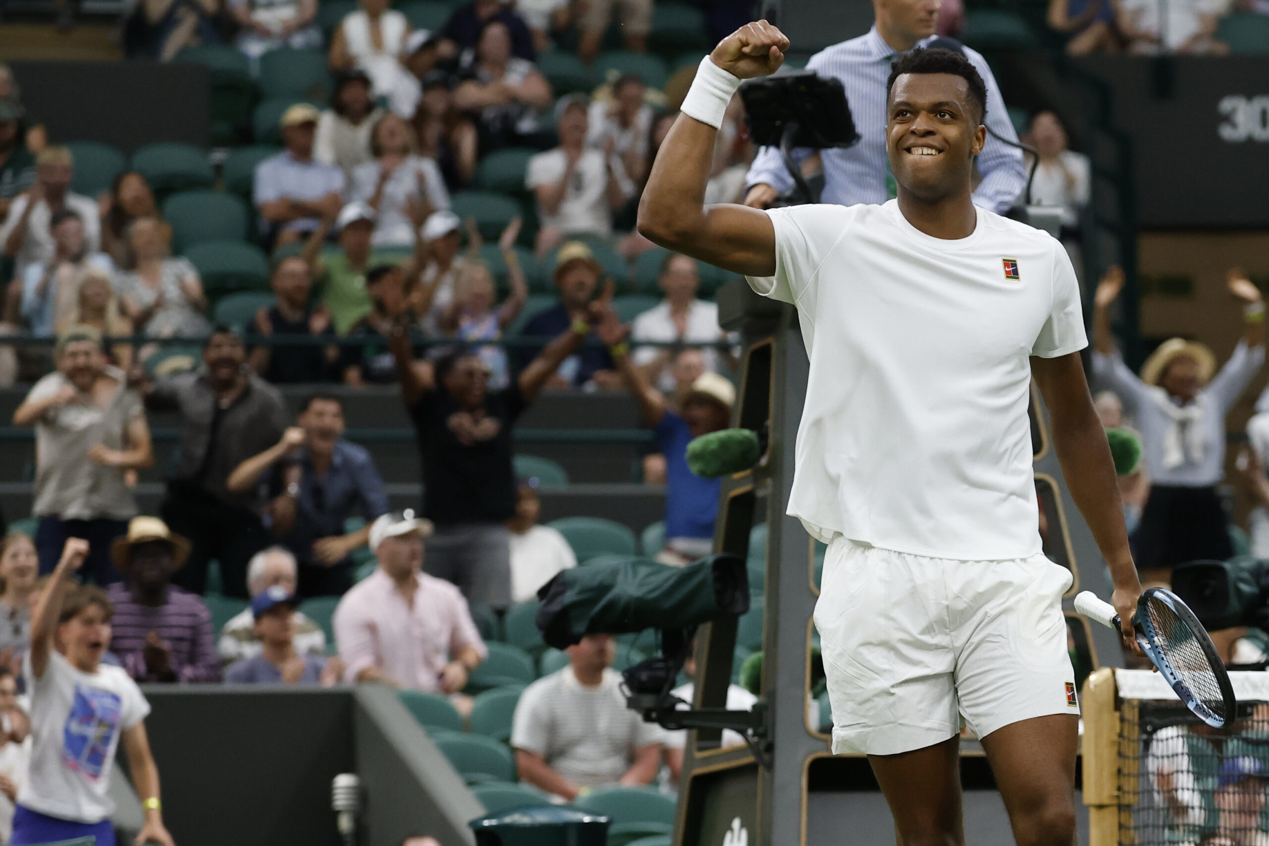 Jun 30, 2025; Wimbledon, United Kingdom; Giovanni Mpetshi Perricard (FRA) reacts after winning a point against Taylor Fritz (USA)(not pictured) on day one of The Championships, Wimbledon 2025 at All England Lawn Tennis and Croquet Club. Mandatory Credit: Geoff Burke-Imagn Images