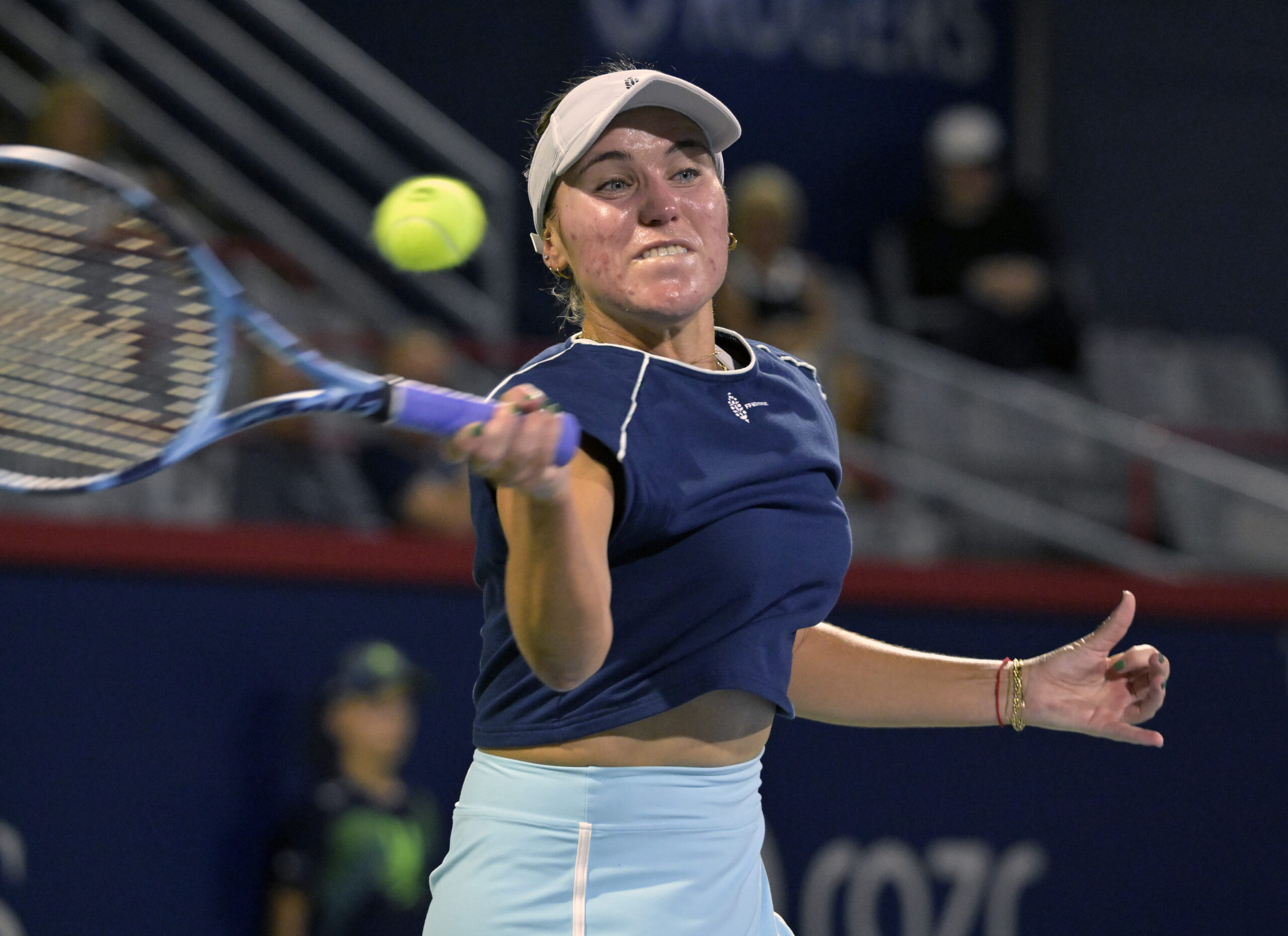 Jul 29, 2025; Montreal, QC, Canada; Sofia Kenin (USA) returns the ball against Victoria Mboko (CAN) in second round play at IGA Stadium. Mandatory Credit: Eric Bolte-Imagn Images