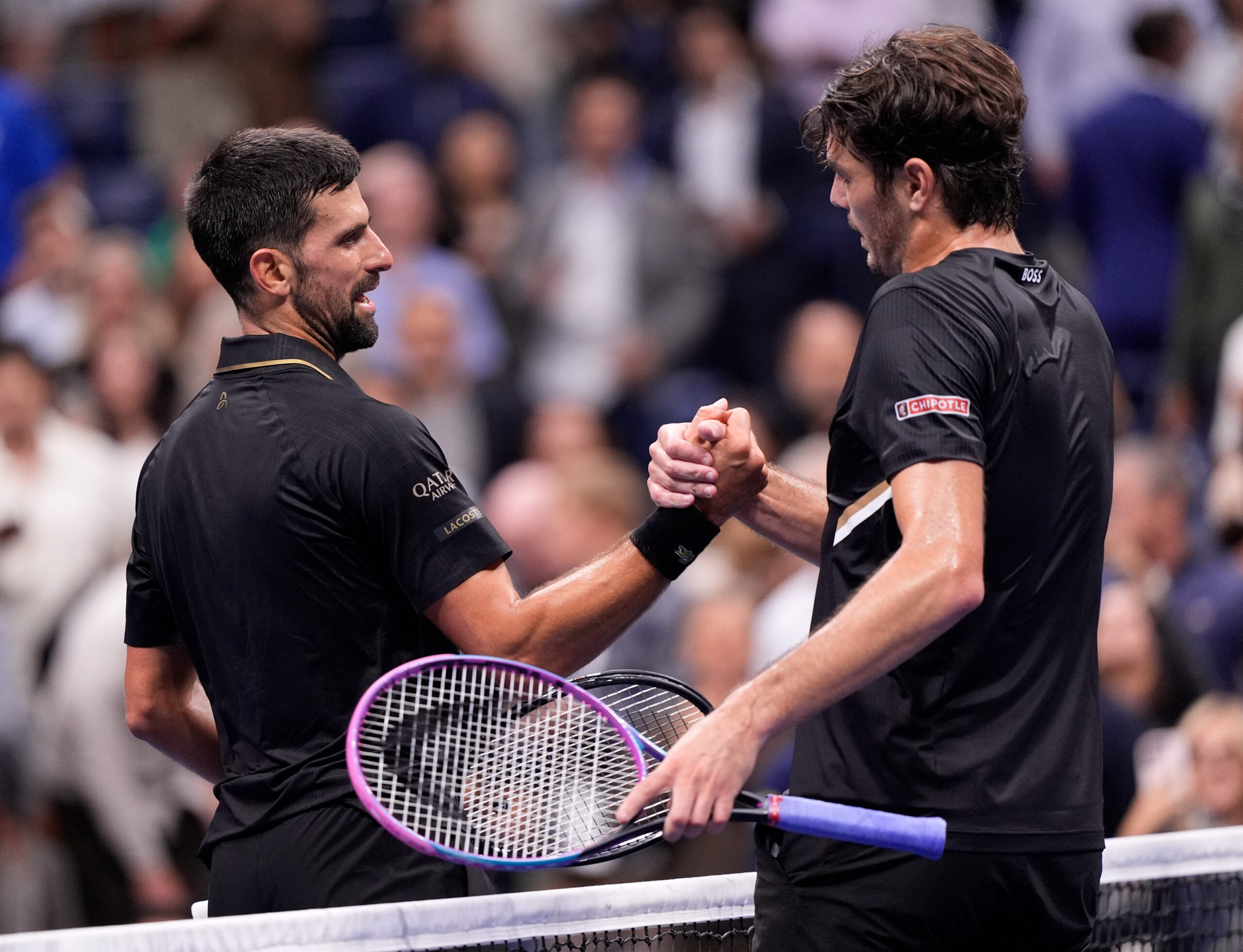Sep 2, 2025; Flushing, NY, USA;  
Novak Djokovic (SRB) (left) after defeating Taylor Fritz (USA) (right) on day ten of the 2025 U.S. Open tennis tournament at the USTA Billie Jean King National Tennis Center. Mandatory Credit: Robert Deutsch-Imagn Images